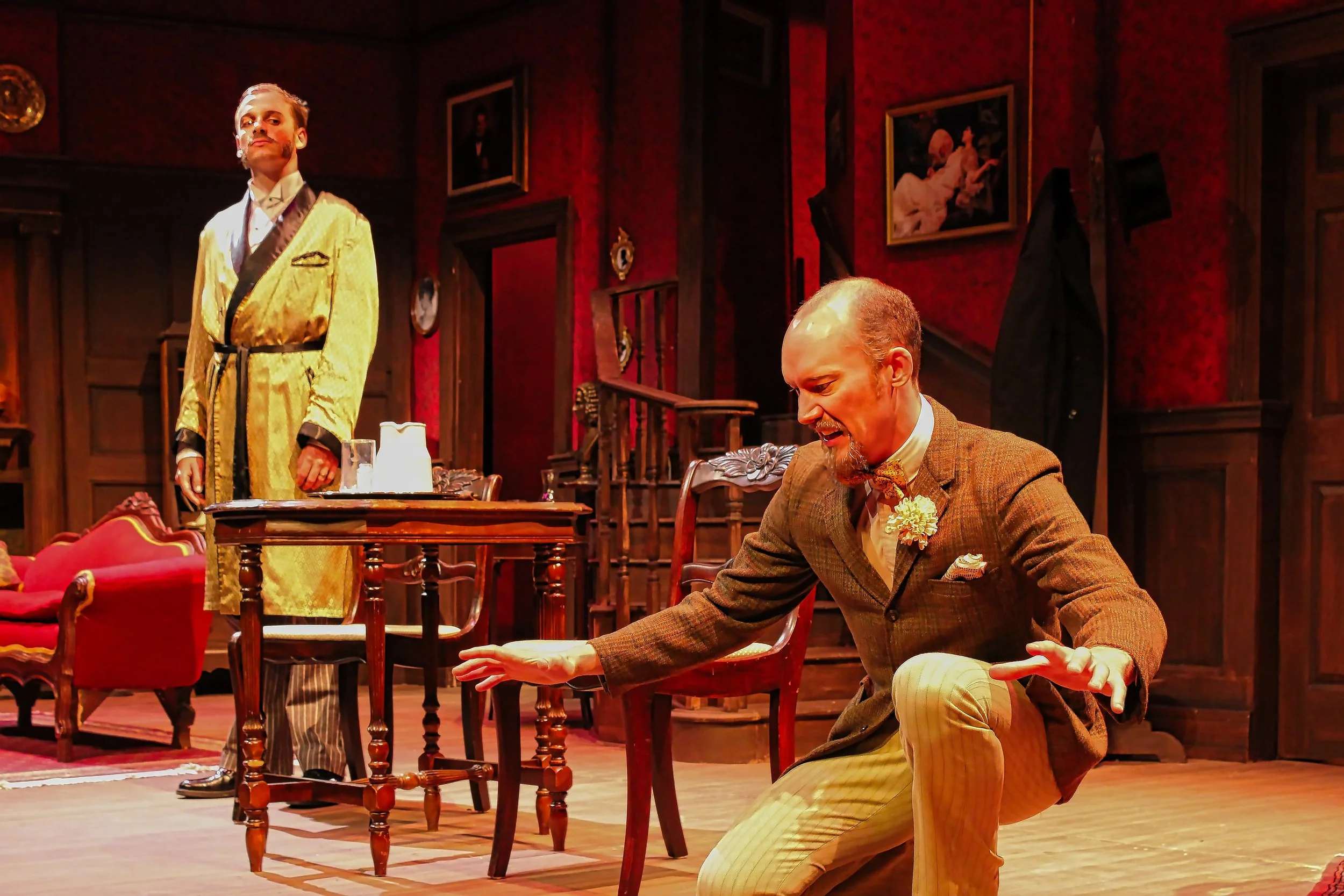Scenic design by Brandon PT Davis for Angel Street at Okoboji Summer Theatre, featuring actors performing on a detailed period living room set.