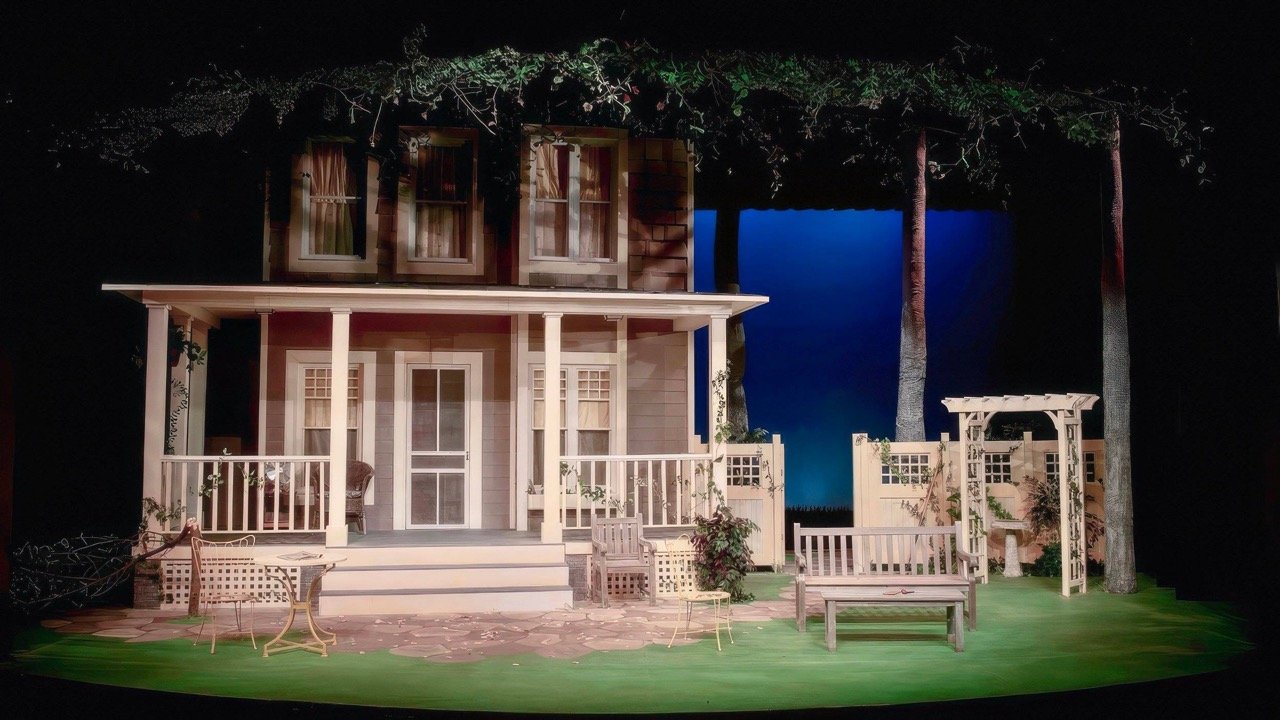 Set Photo of All My Sons. Vibrant, Lush outdoor setting. Midwestern Farm House.