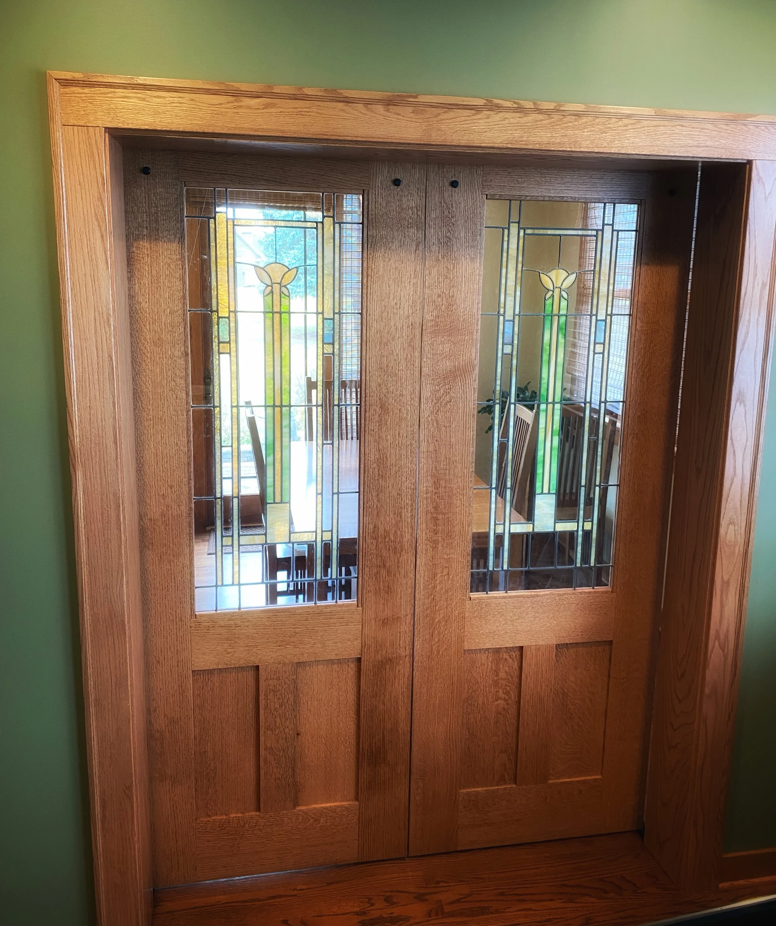 Statement pieces like these doors can be built to reflect the style throughout the rest of the home.