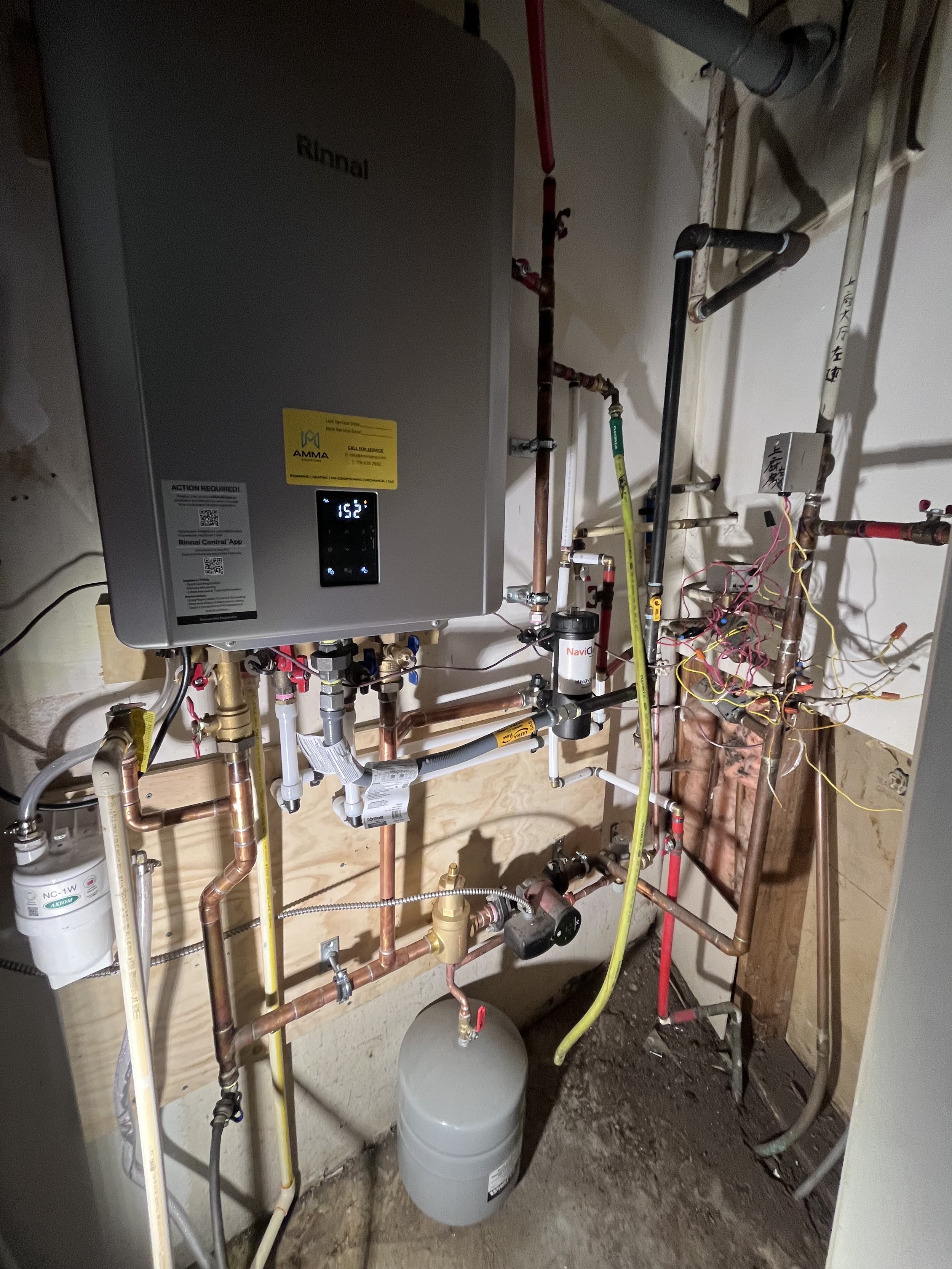 High-efficiency Rinnai combi boiler replacement with new piping and expansion tank installed for residential heating and hot water in Vancouver BC