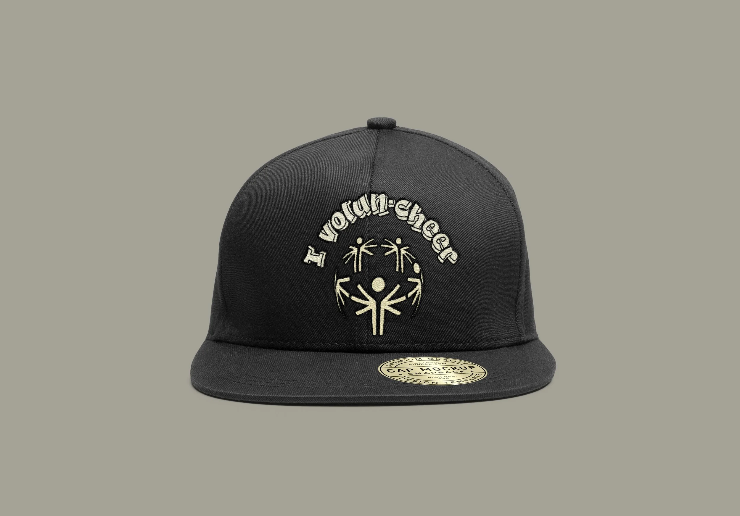 Black baseball cap with white embroidered text and design, featuring the words 'I volunteer' and a stylized human figure with outstretched arms surrounded by plant-like designs.