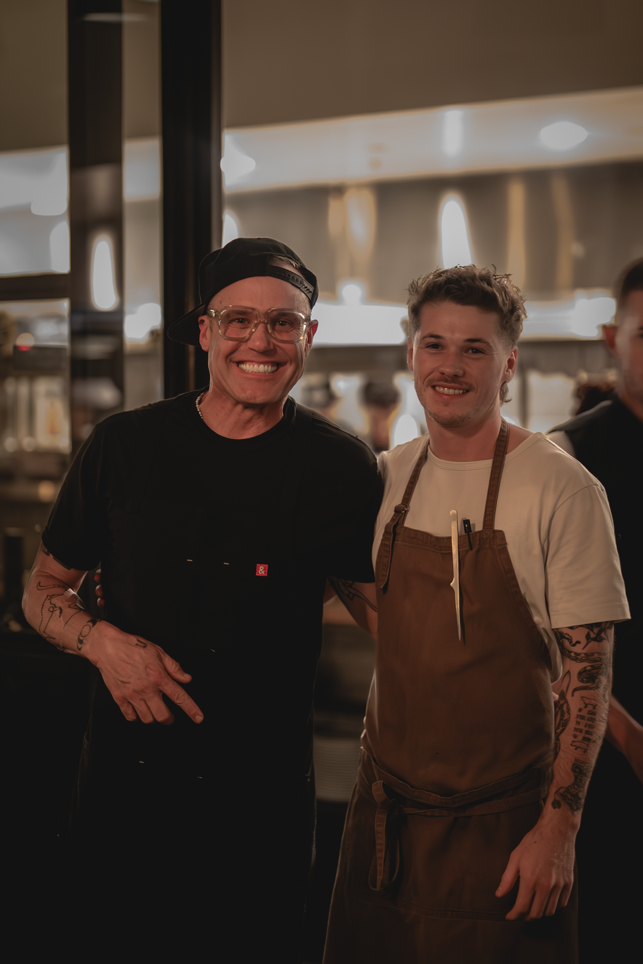 Chef Aidan Owens in the kitchen at Herb & Wood featured in San Diego Magazine