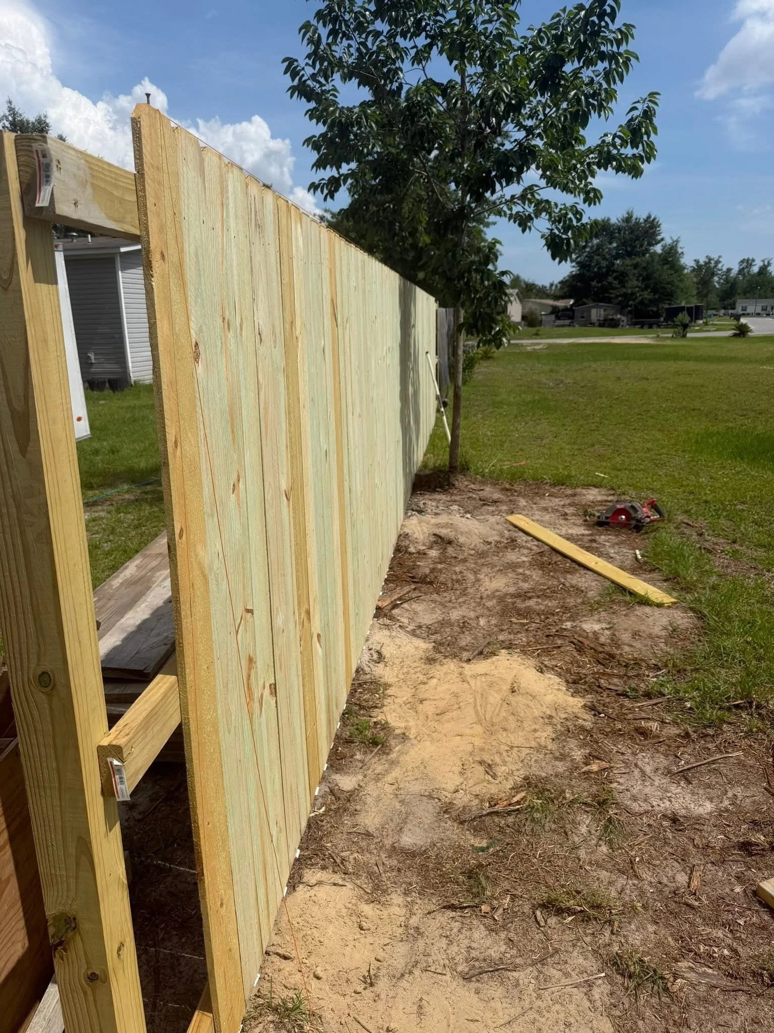 Straight and sturdy new fence to replace older fence.