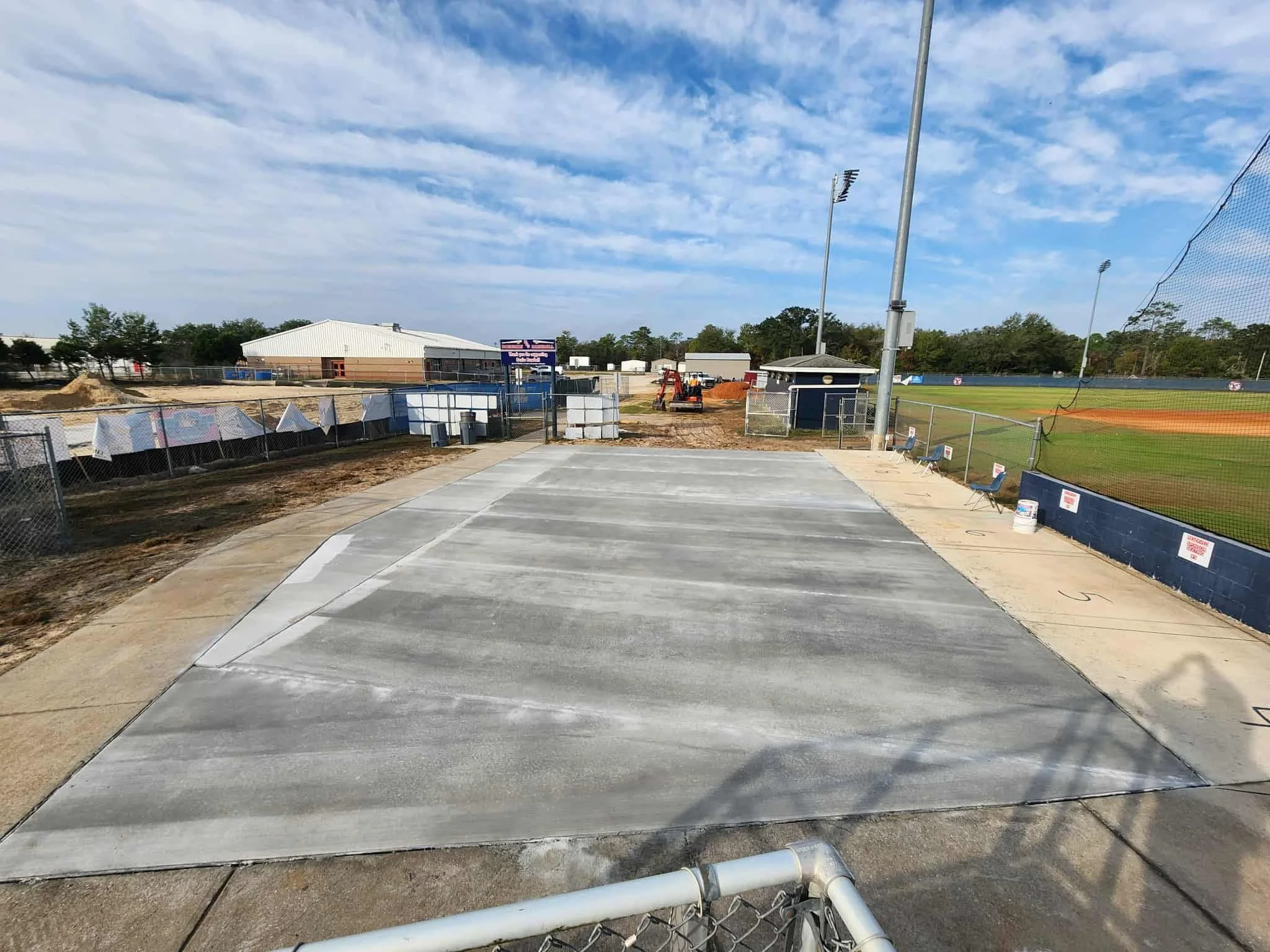 Local school baseball field with new concrete slab.