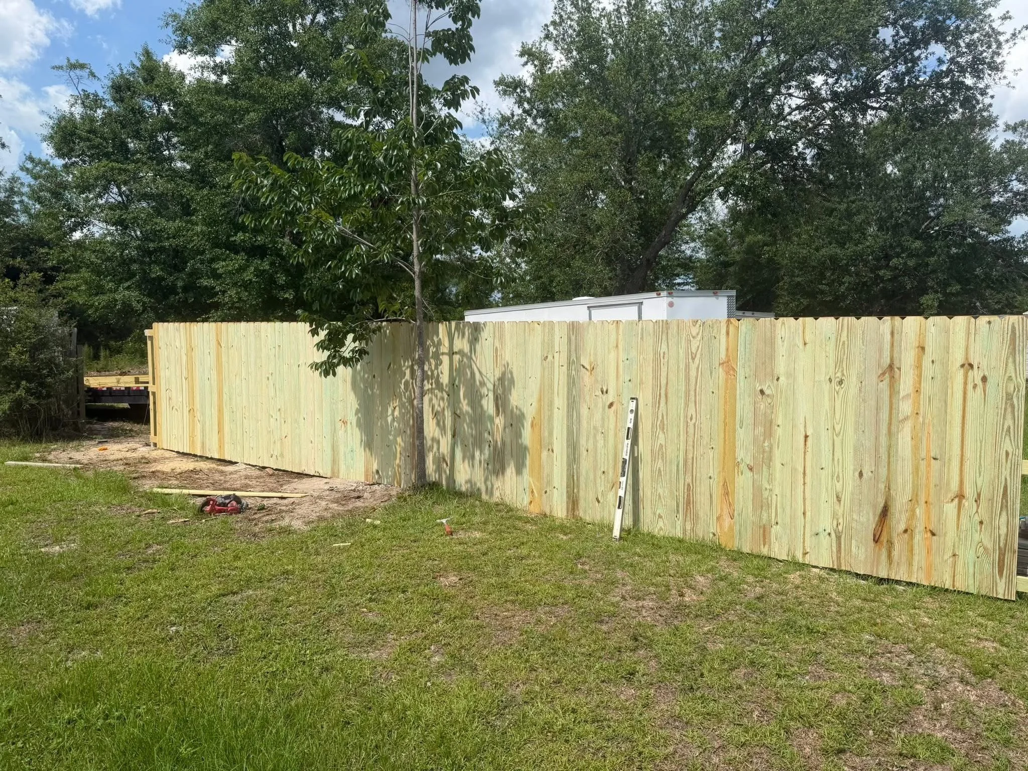 Replaced old fence with new wood fence.