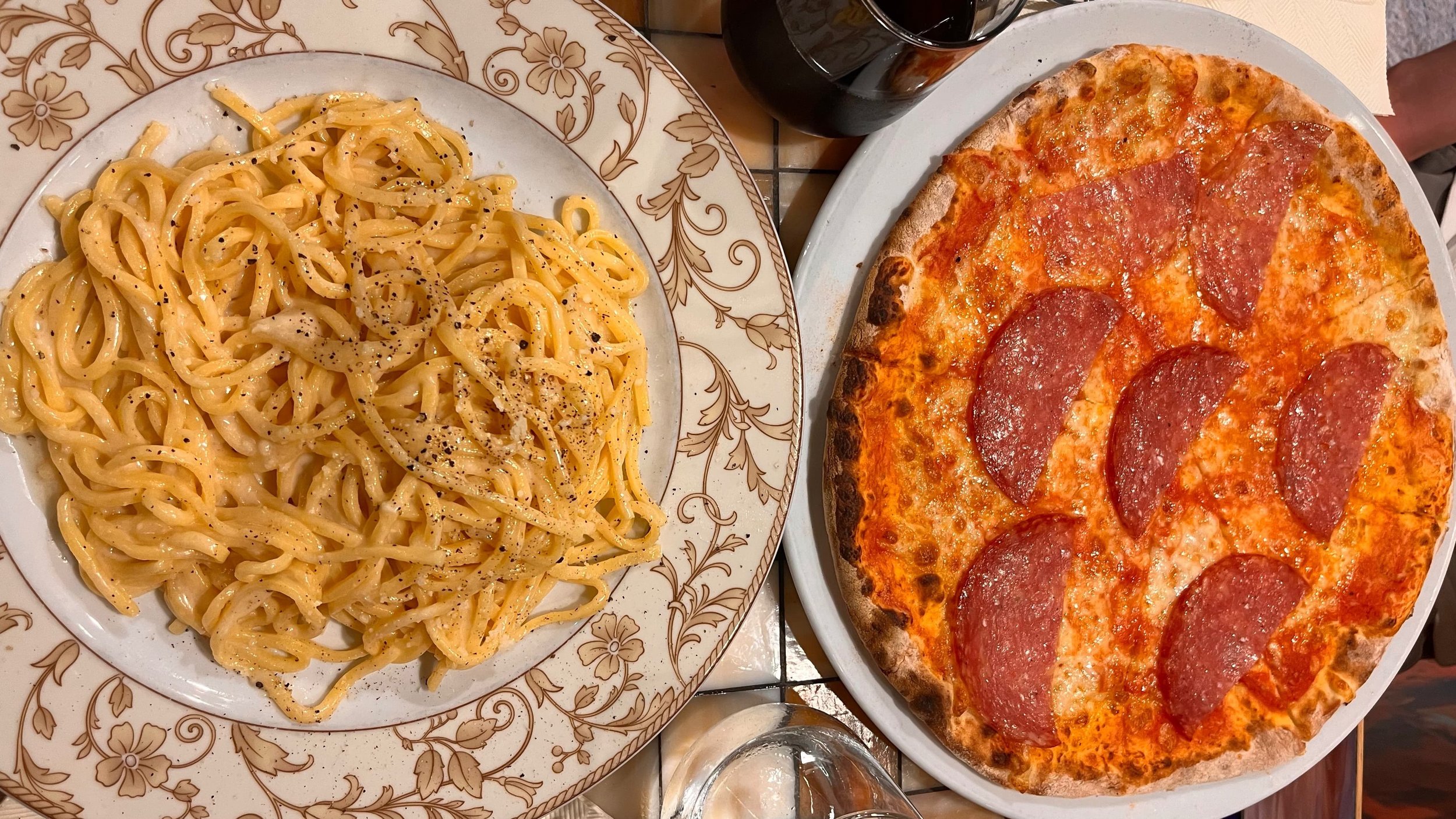 Tasting creamy carbonara at Pinsitaly Trevi, a must-try pasta spot in Rome.