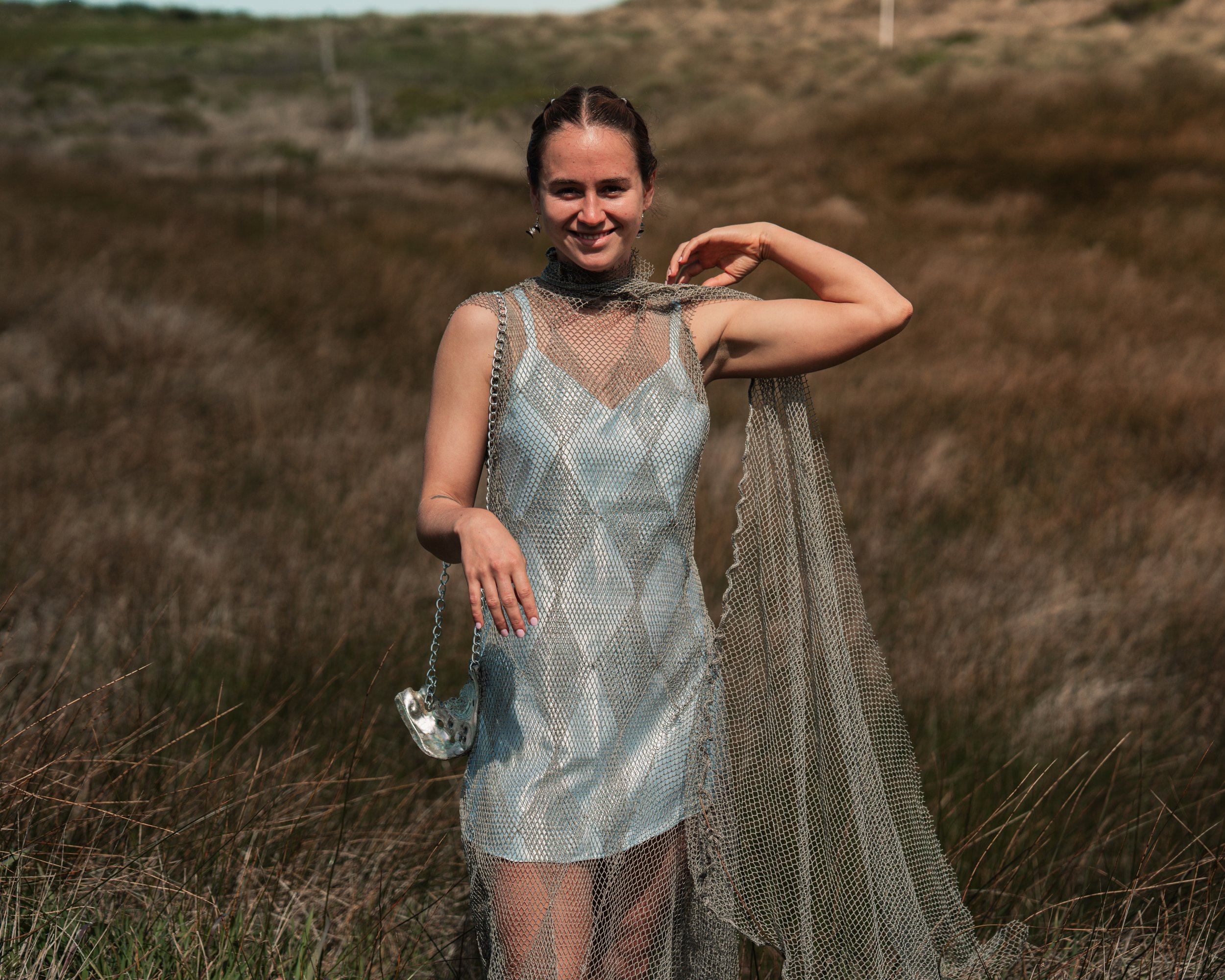 Diamond appliqué reclaimed net gown by Anna Goetter, cyanotype printed slip dress by Katie Erickson, abalone chain purse by Erica Goodwin.
Photo by Jonathan Aguiñaga