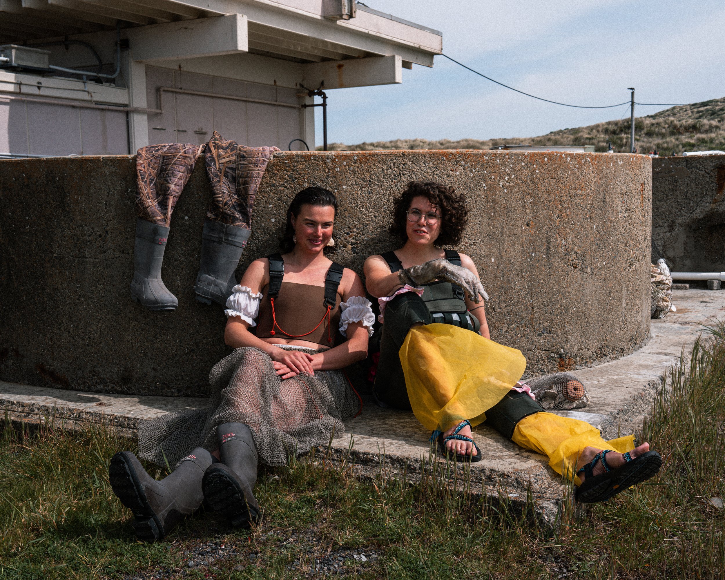 Left: Upcycled wader top by Katie Erickson and Sitoë Thiam, ruffle sleeves and bloomers by Katie Erickson, reclaimed fishing net bubble skirt by Sitoë Thiam, shell earrings by Erica Goodwin.
Right: Fish leather glove by Anna Goetter, patchwork wove