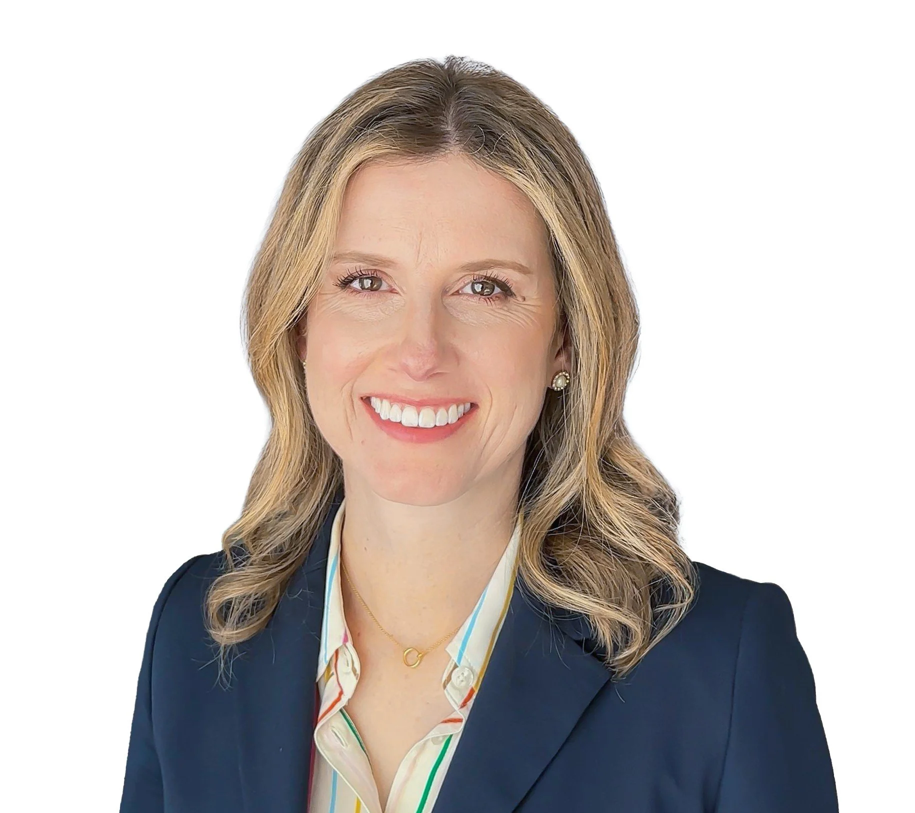 Portrait of a smiling woman with blonde hair, wearing a dark blazer over a colorful blouse, and gold jewelry, against a white background.