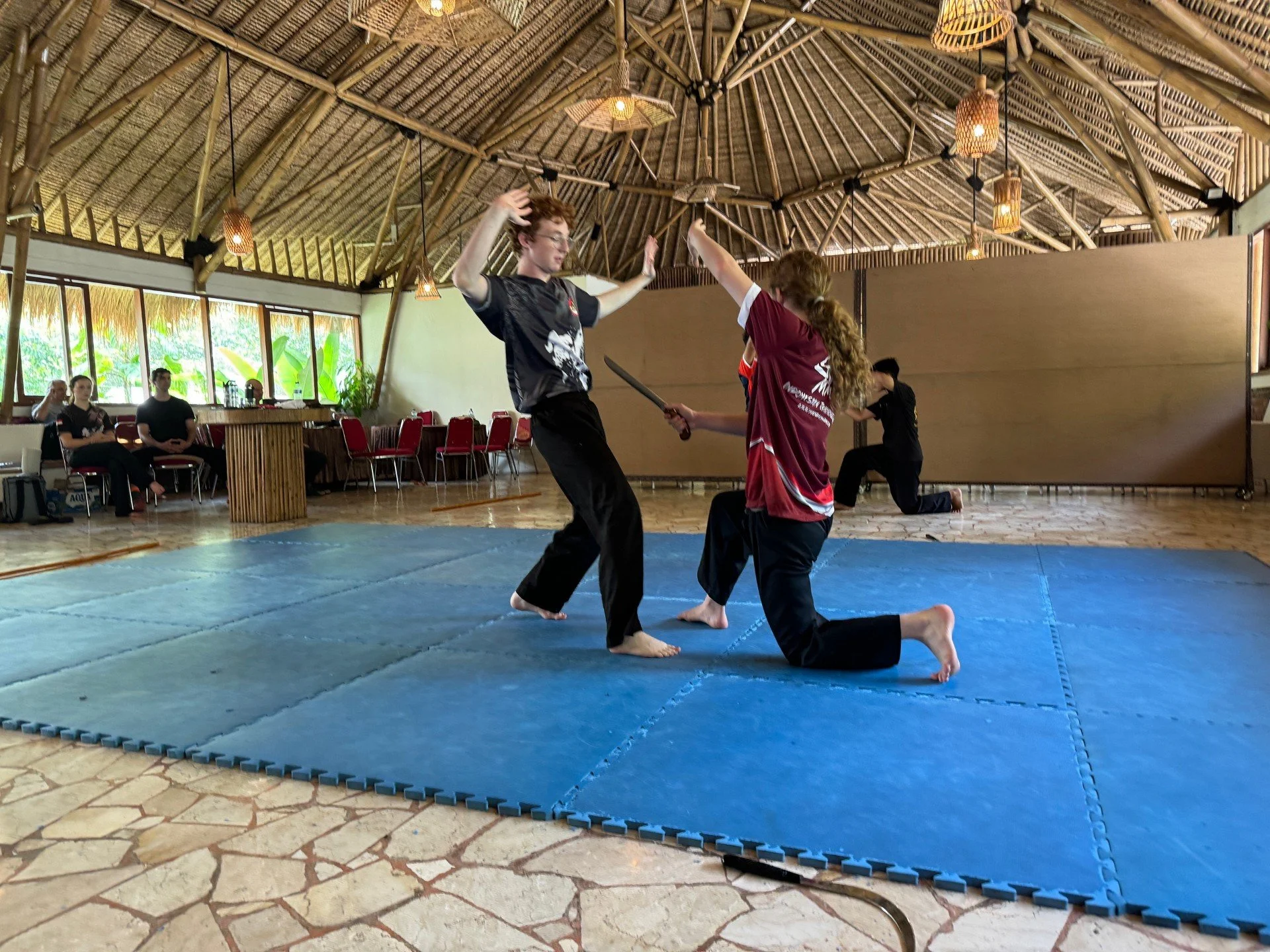 At the Mande Muda Training Camp 2024, students practice 2-person Ganda performance.