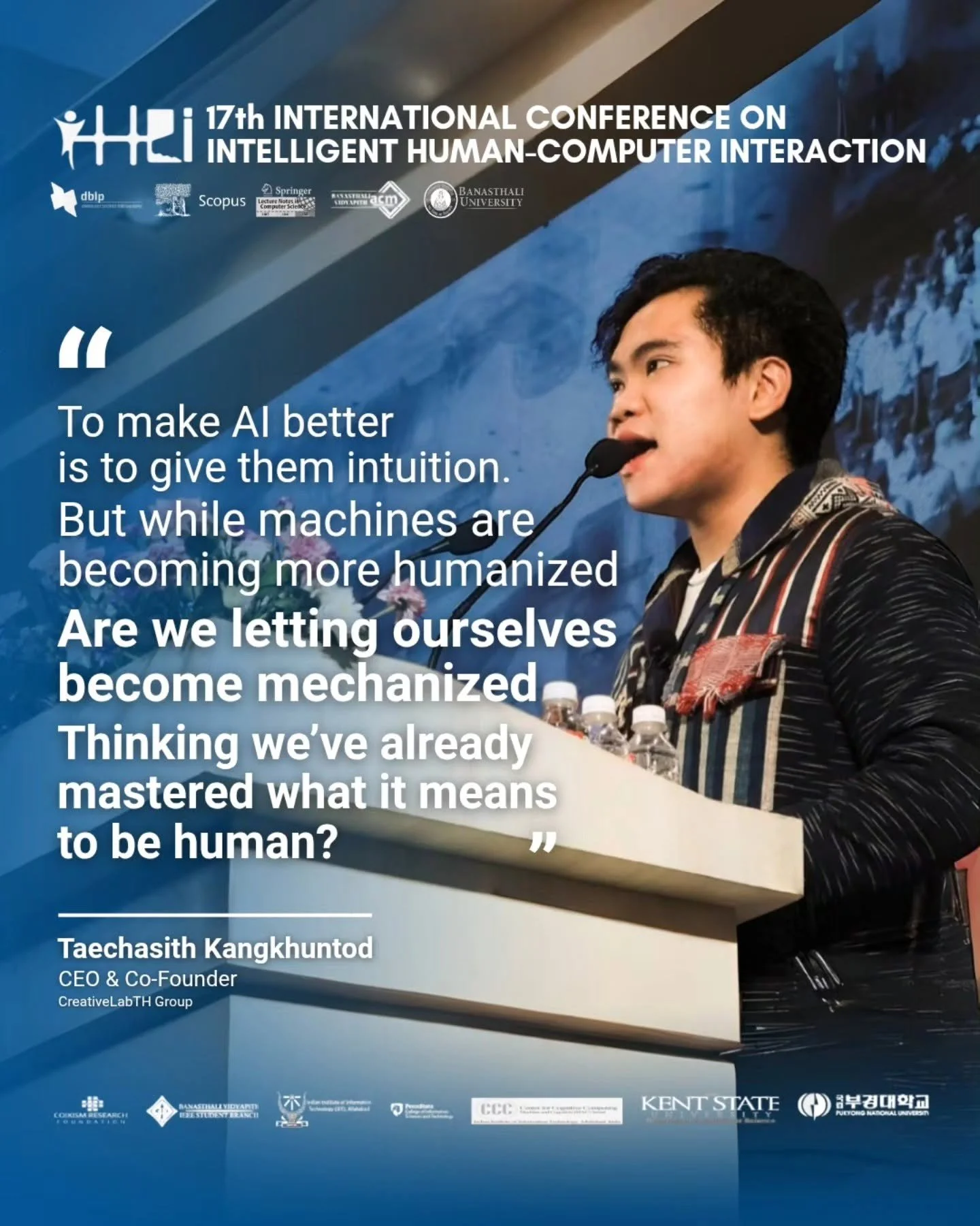 A speaker at a conference, identified as Taechasith Kangkuntod, is delivering a speech at the 17th International Conference on Intelligent Human-Computer Interaction. The background displays a mountain landscape with snow. The slide contains a quote about AI and humanization, and logos of various academic and research institutions at the top.