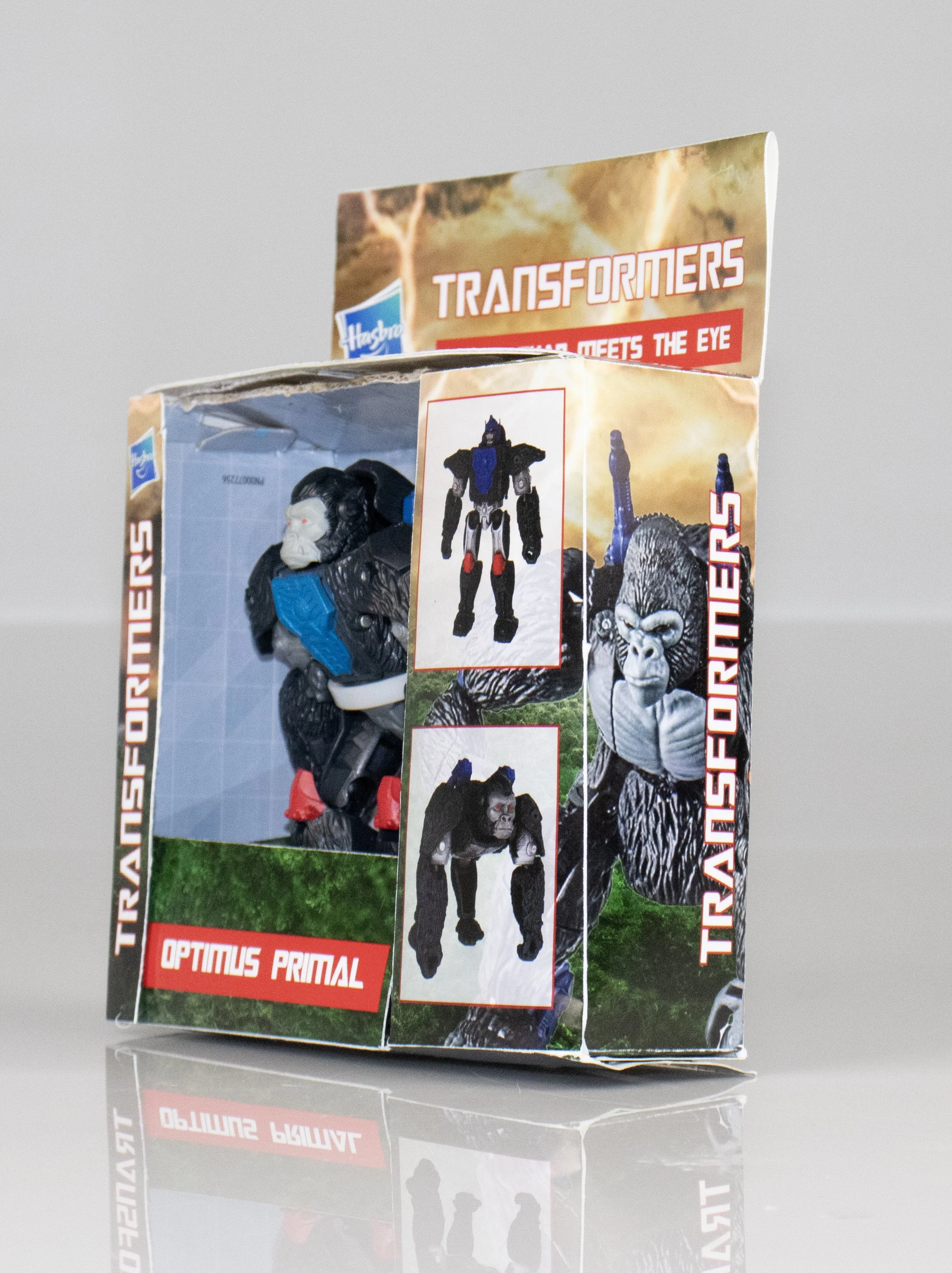 A Transformers toy box featuring Optimus Primal, with images of the toy and artwork of a gorilla robot on the packaging.