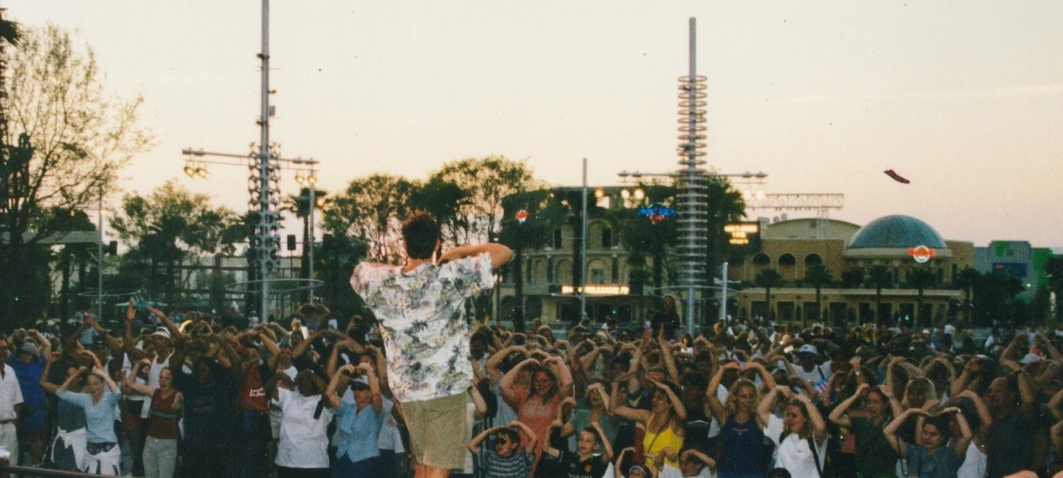 Mitch Mitchem working a massive CityWalk crowd at dusk, Universal Studios Orlando