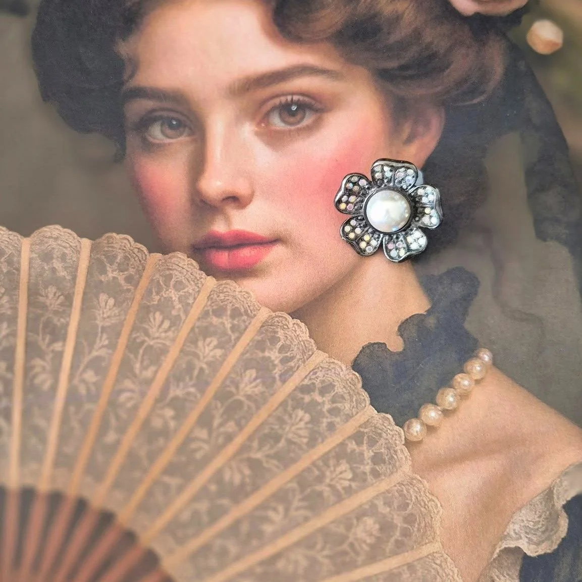 🌙&quot;Moonlit Bloom&quot; ✨

A vintage floral stud glowing with quiet drama &mdash; textured antiqued silver petals, a luminous faux pearl heart, and a dusting of iridescent sparkle. A little piece of moonlit romance for your ear.

📍Single earring