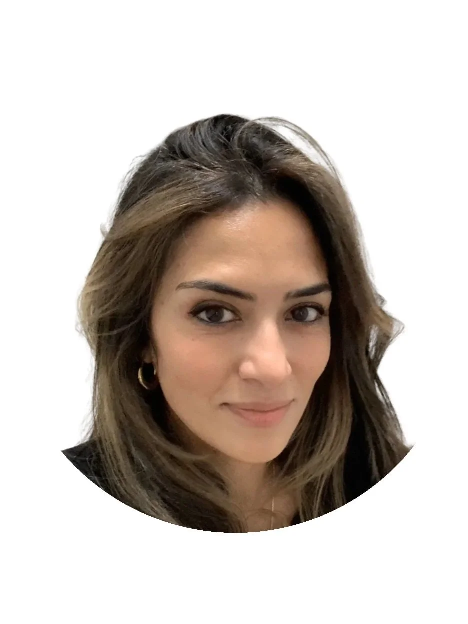 Portrait of a woman with brown hair and hoop earrings, smiling slightly, on a white background.