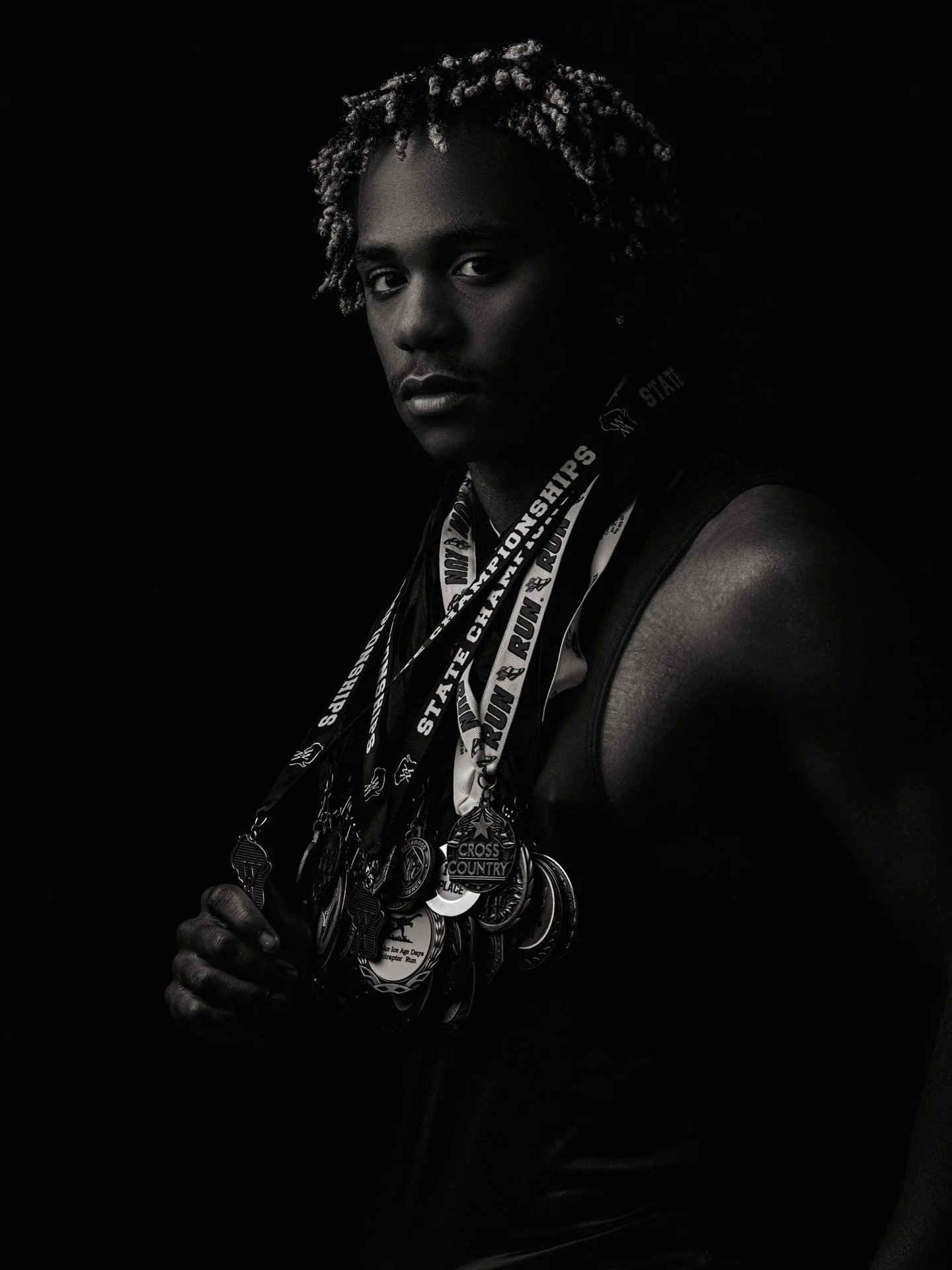 Kaleb 

#highschoolseniorphotos #trackstar #riblake #cross #medals