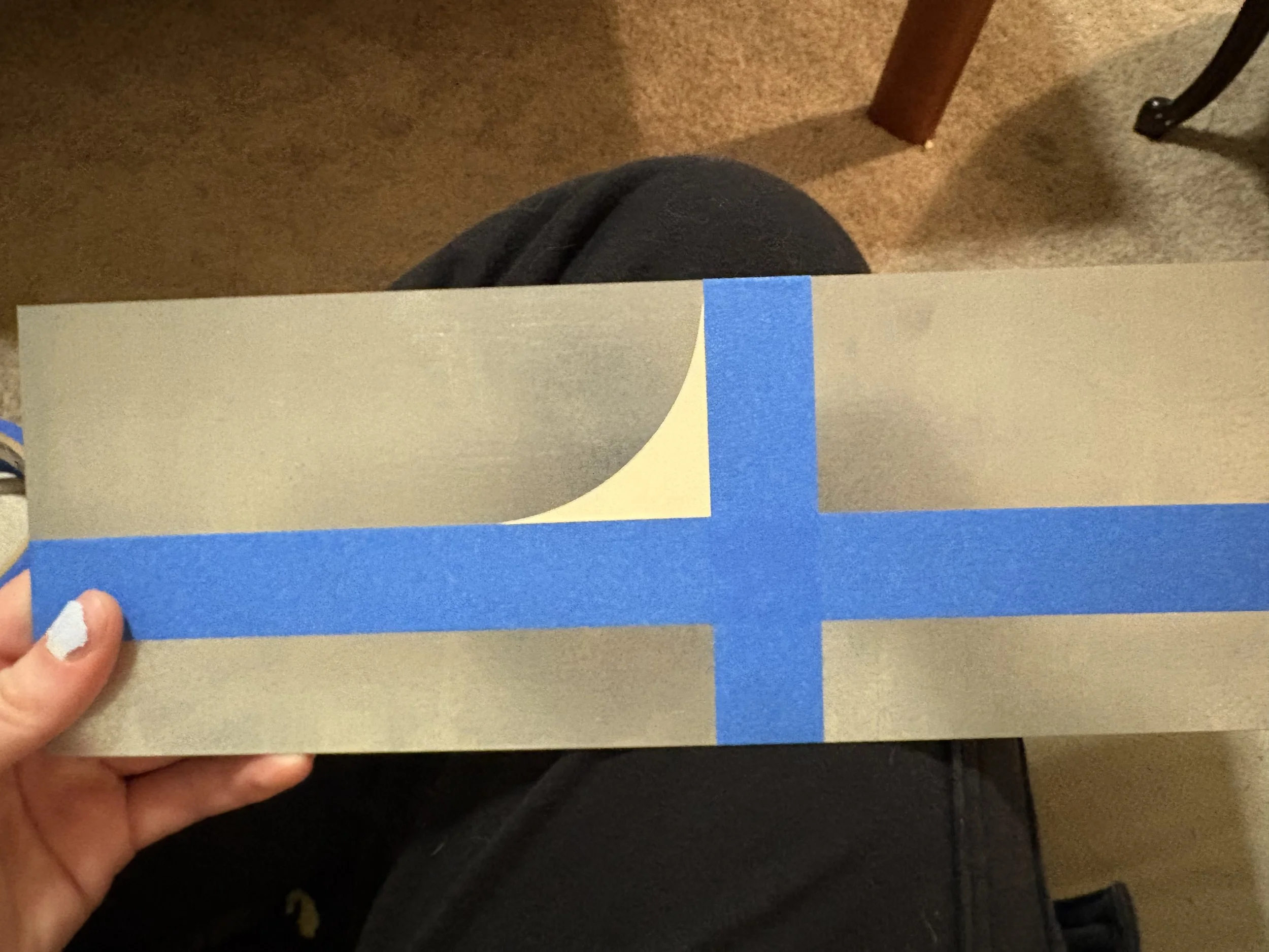 Step three of application: paste the sticker, avoiding bubbles, creases, and stretching.