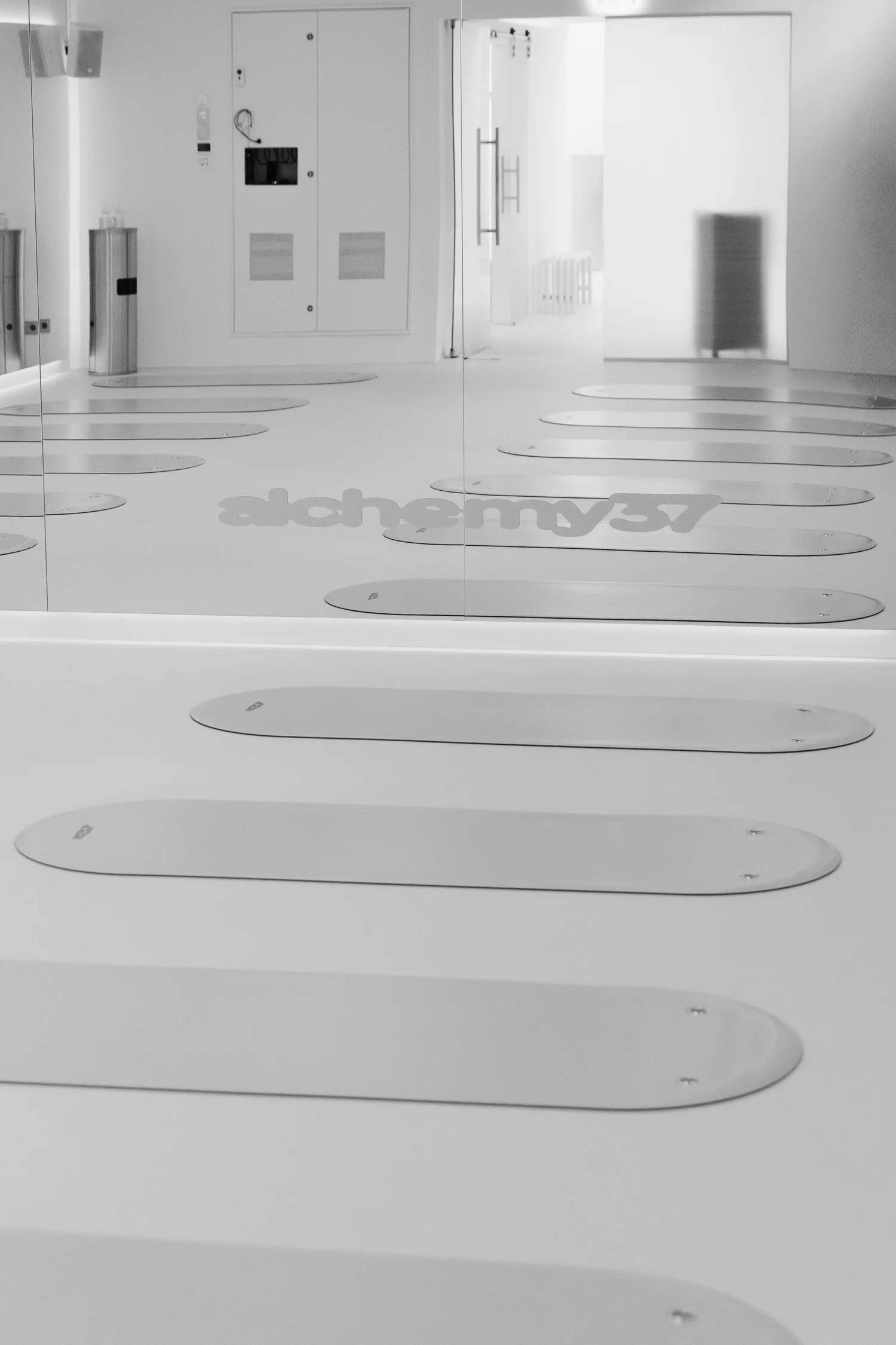 The studio floor with mats and Alchemy37 branding