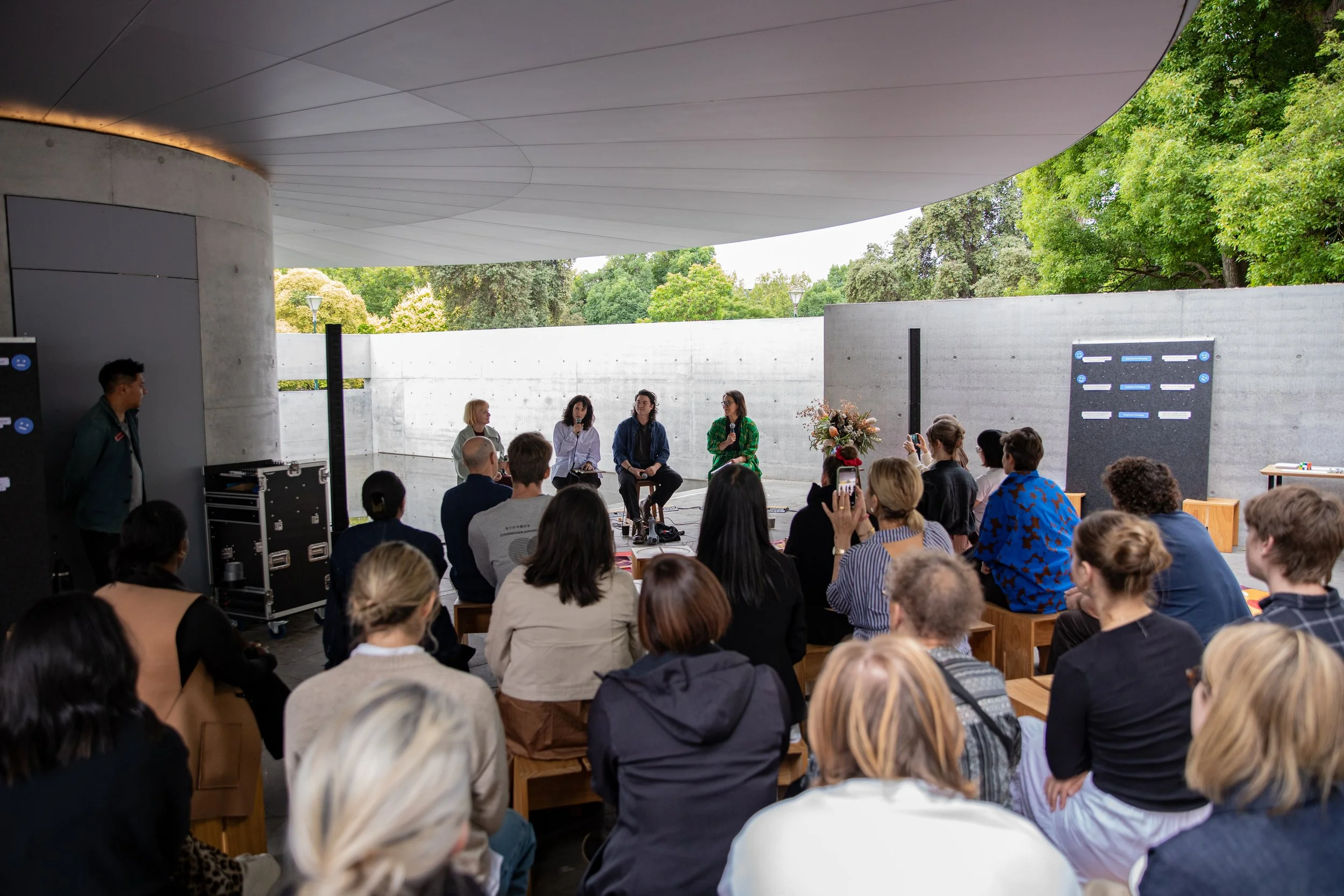 A diverse crowd of people gathered for a panel discussion on design at MPavilion. The discussion is part of Shaping the Atlas of Belonging curated by Jocelyn Chiew, Tim Dow and Annelise Porter.