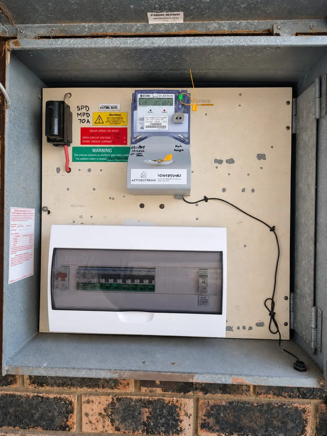 Rosemeadow residence electrical distribution board with enclosed circuit-protection devices below the electricity meter