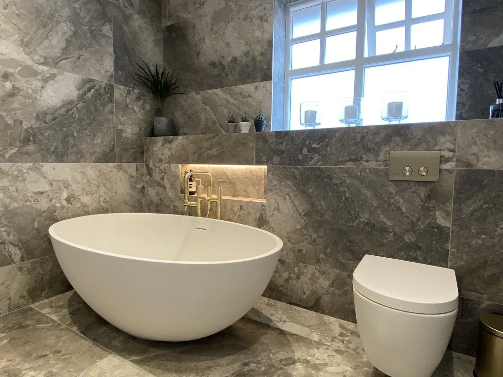 Master ensuite. Wall hung vanity. Free standing bath. Walk-in shower. Brass hardware. Hand held shower. Sports shower head. Rainfall shower head. Large format tiles. Recessed shelves.