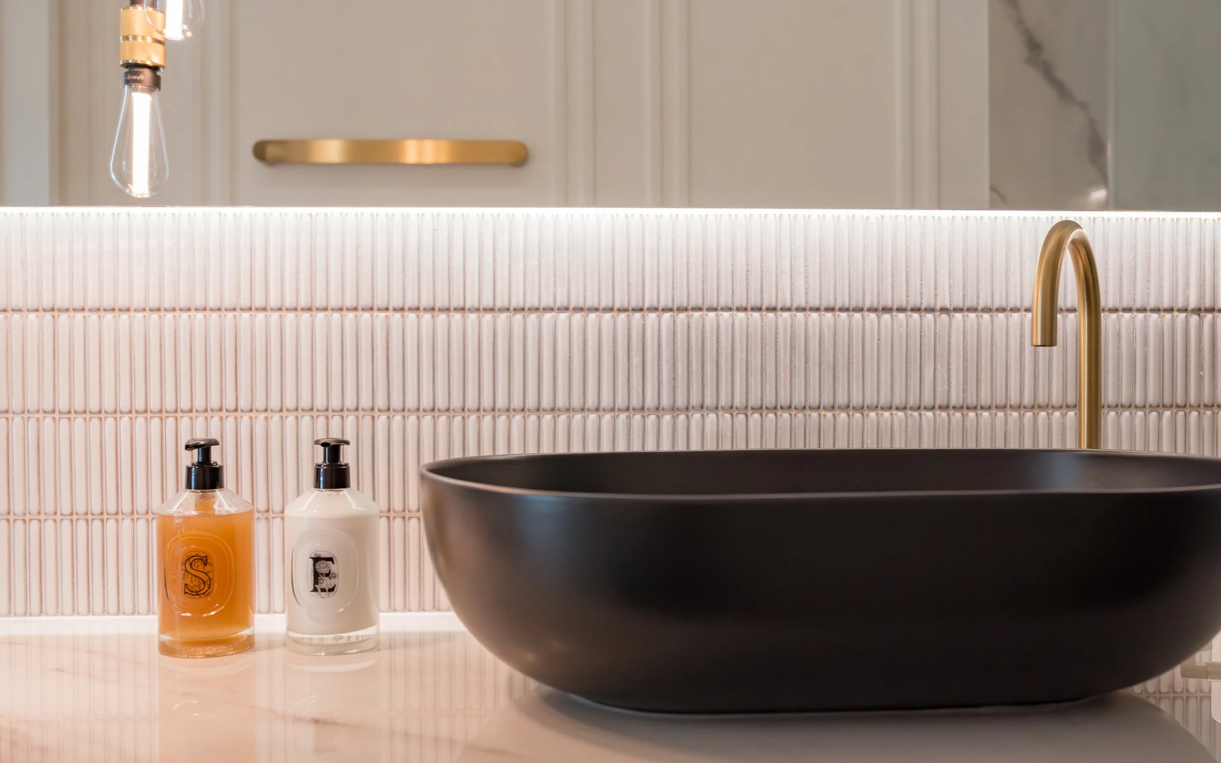 Guest ensuite. Large format tiles. Bespoke vanity. Countertop basin. Mosaics. Walk in shower. Brass hardware.