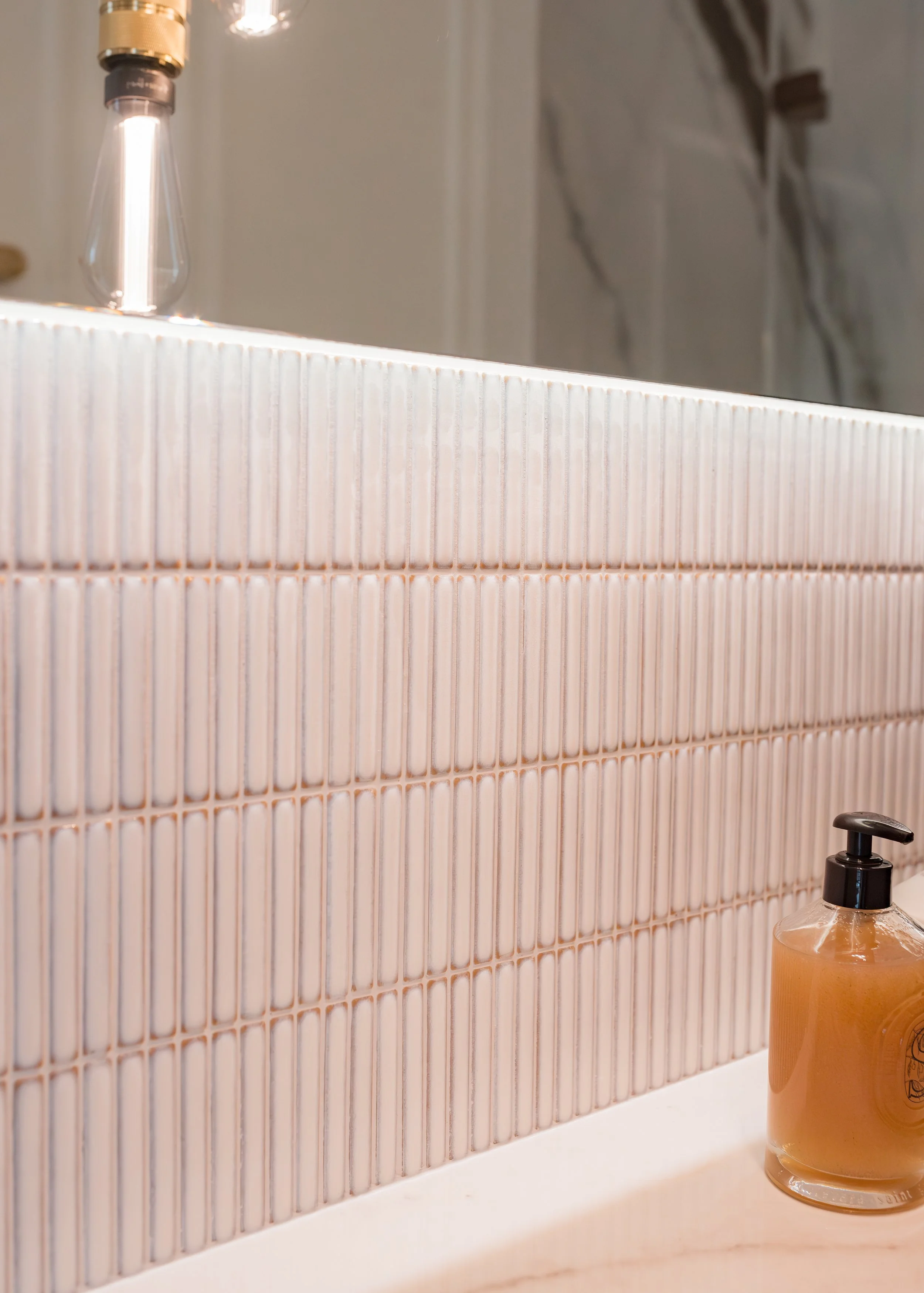 Guest ensuite. Large format tiles. Bespoke vanity. Countertop basin. Mosaics. Walk in shower. Brass hardware.