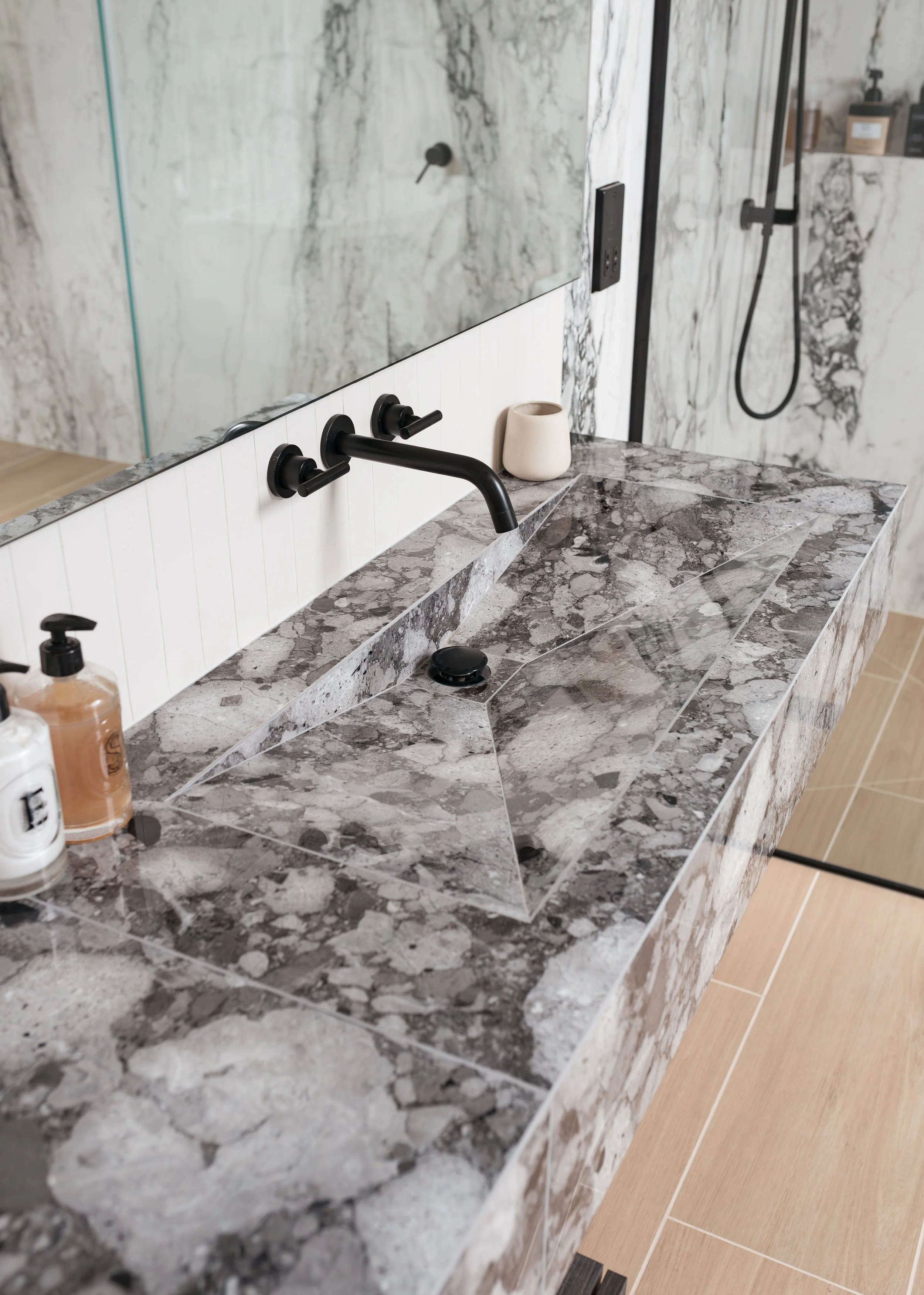 Guest ensuite. Large format tiles. Bespoke vanity. Bespoke basin, Walk in shower. Wall mounted taps.