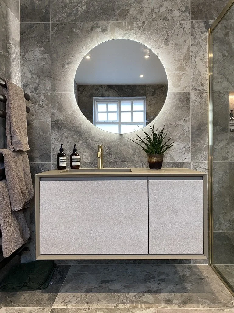 Master ensuite. Wall hung vanity. Free standing bath. Walk-in shower. Brass hardware. Hand held shower. Sports shower head. Rainfall shower head. Large format tiles. Recessed shelves.