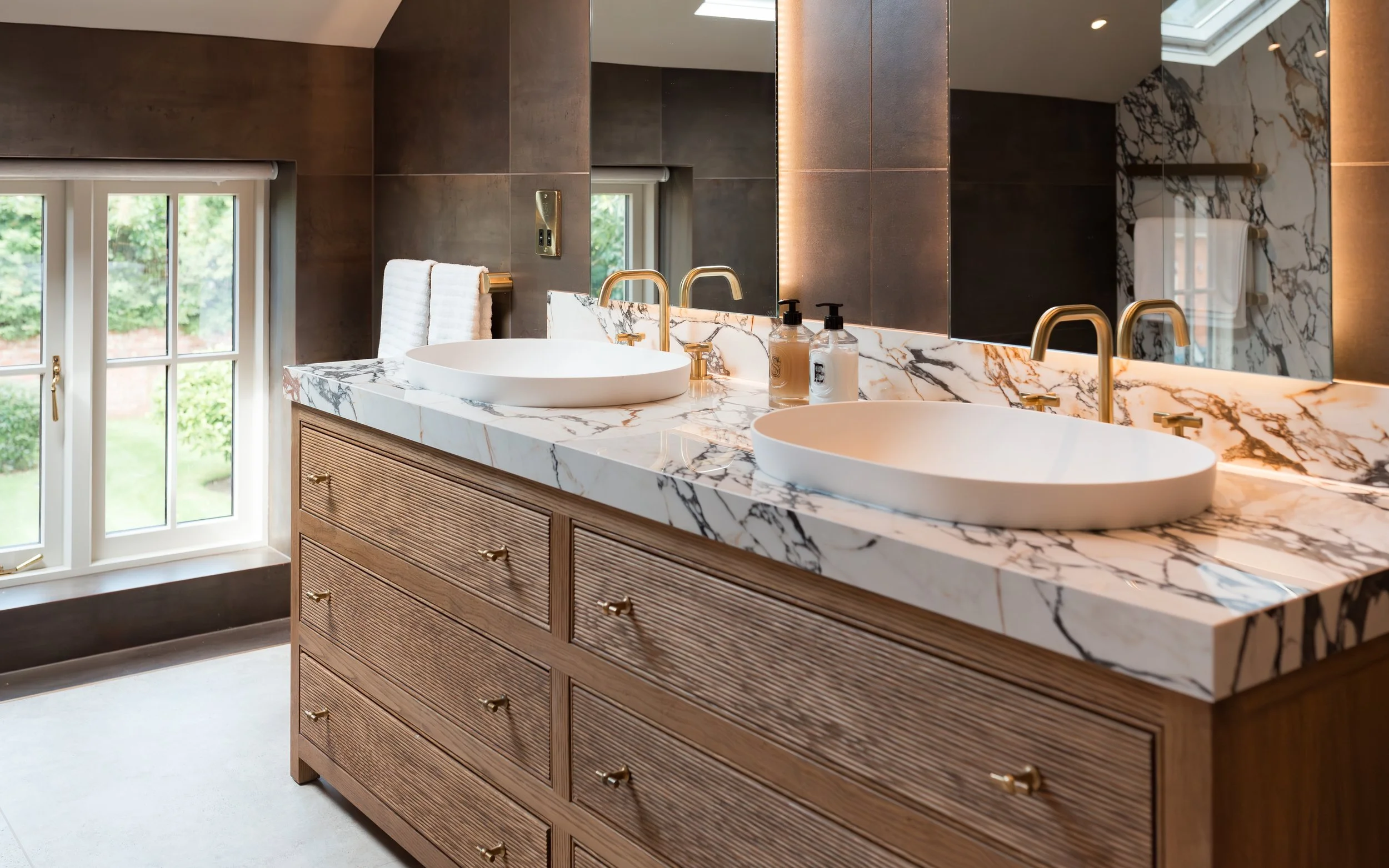Master ensuite. Double vanity. Bespoke vanity top. Double basins. Large format tiles. Double shower. Recessed, mitred shelves. Flowing shelves. Bespoke shower glass.