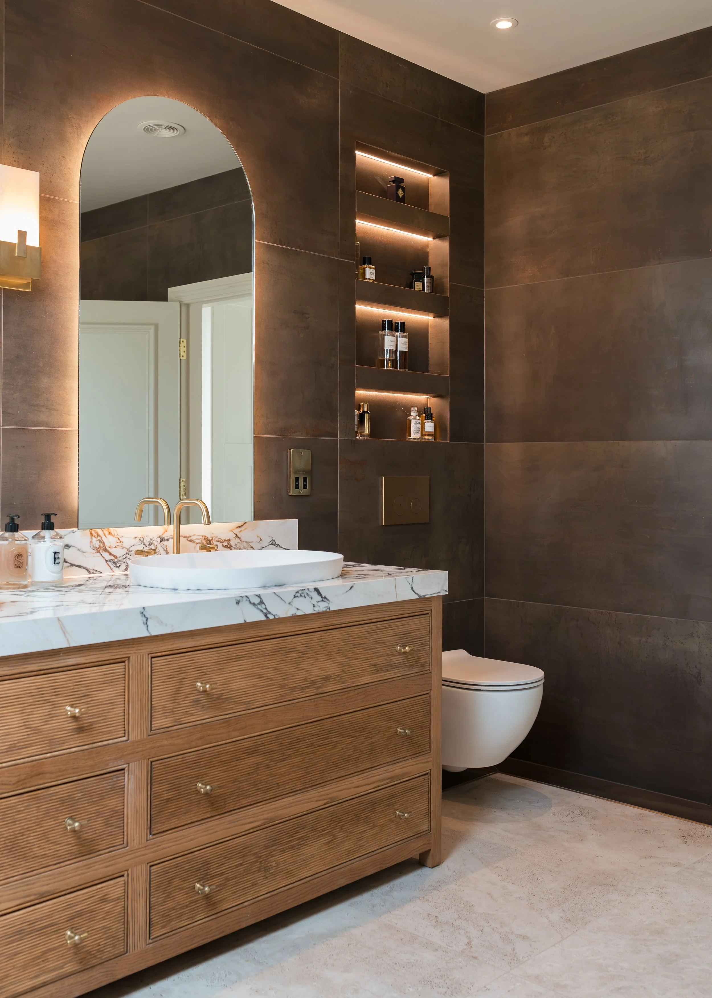 Master ensuite. Double vanity. Bespoke vanity top. Double basins. Large format tiles. Double shower. Recessed, mitred shelves. Flowing shelves. Bespoke shower glass.