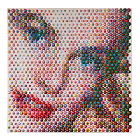 Close-up of a woman's face created with colorful pixels, showing her eye, eyebrow, and lips. Gavin Rain.