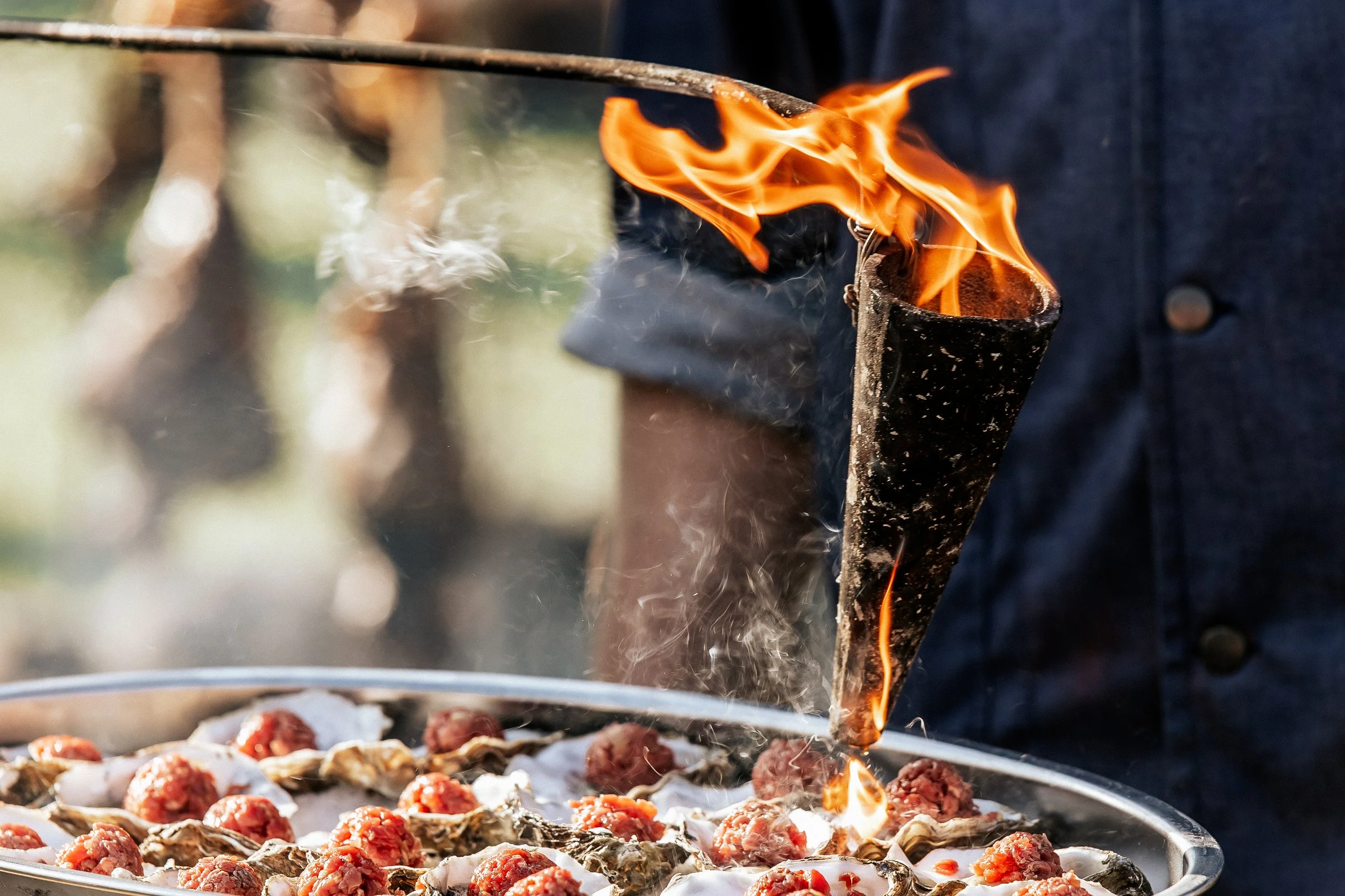 Flambéed oysters with tartare,