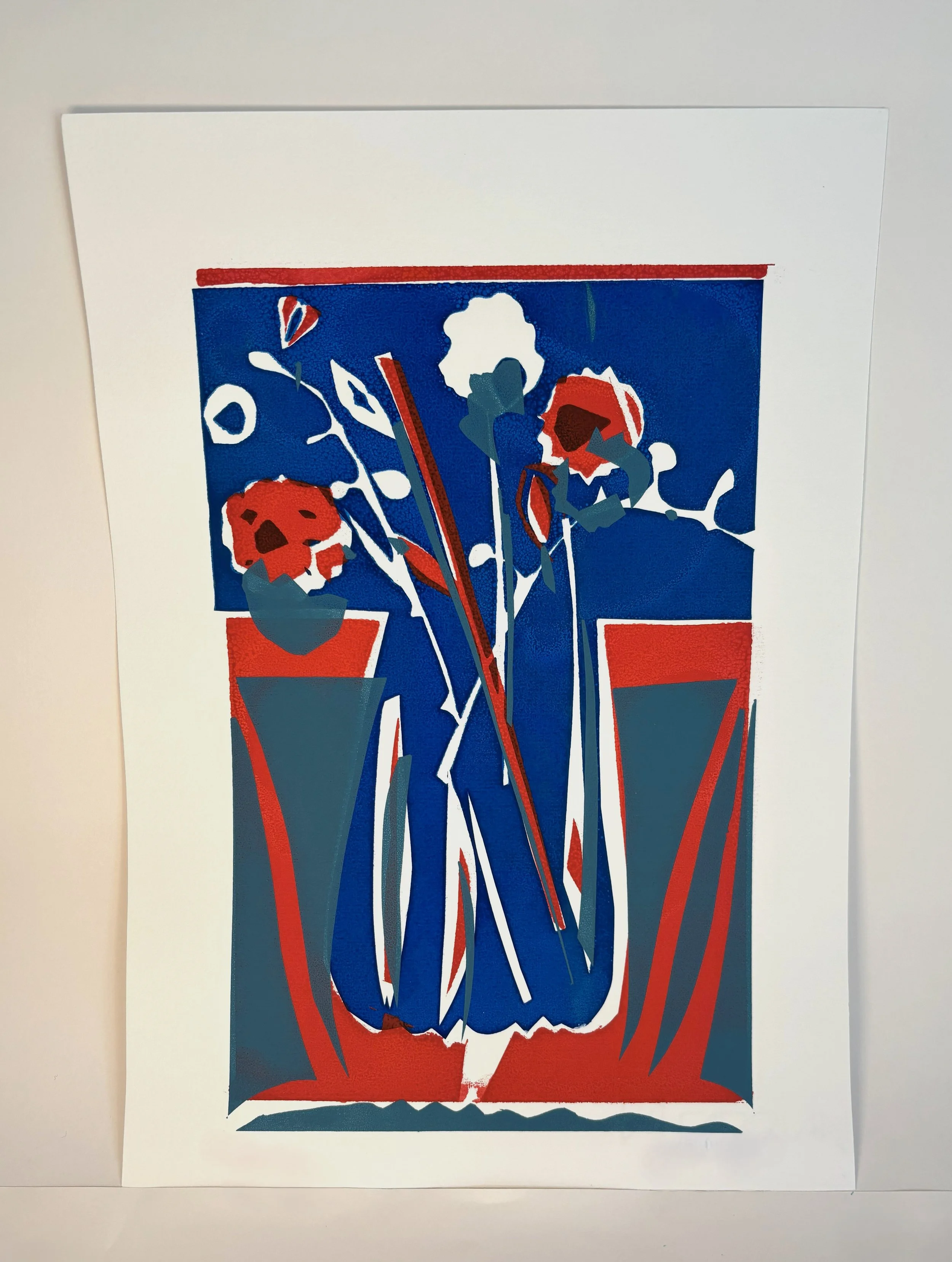 Blue blue vase with red flowers