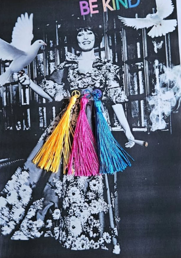 Black-and-white collage of a woman with short hair and a floral dress, surrounded by white doves and colorful tassels in yellow, pink, and blue hanging in front of her. 'BE KIND' is written in multicolored letters at the top.