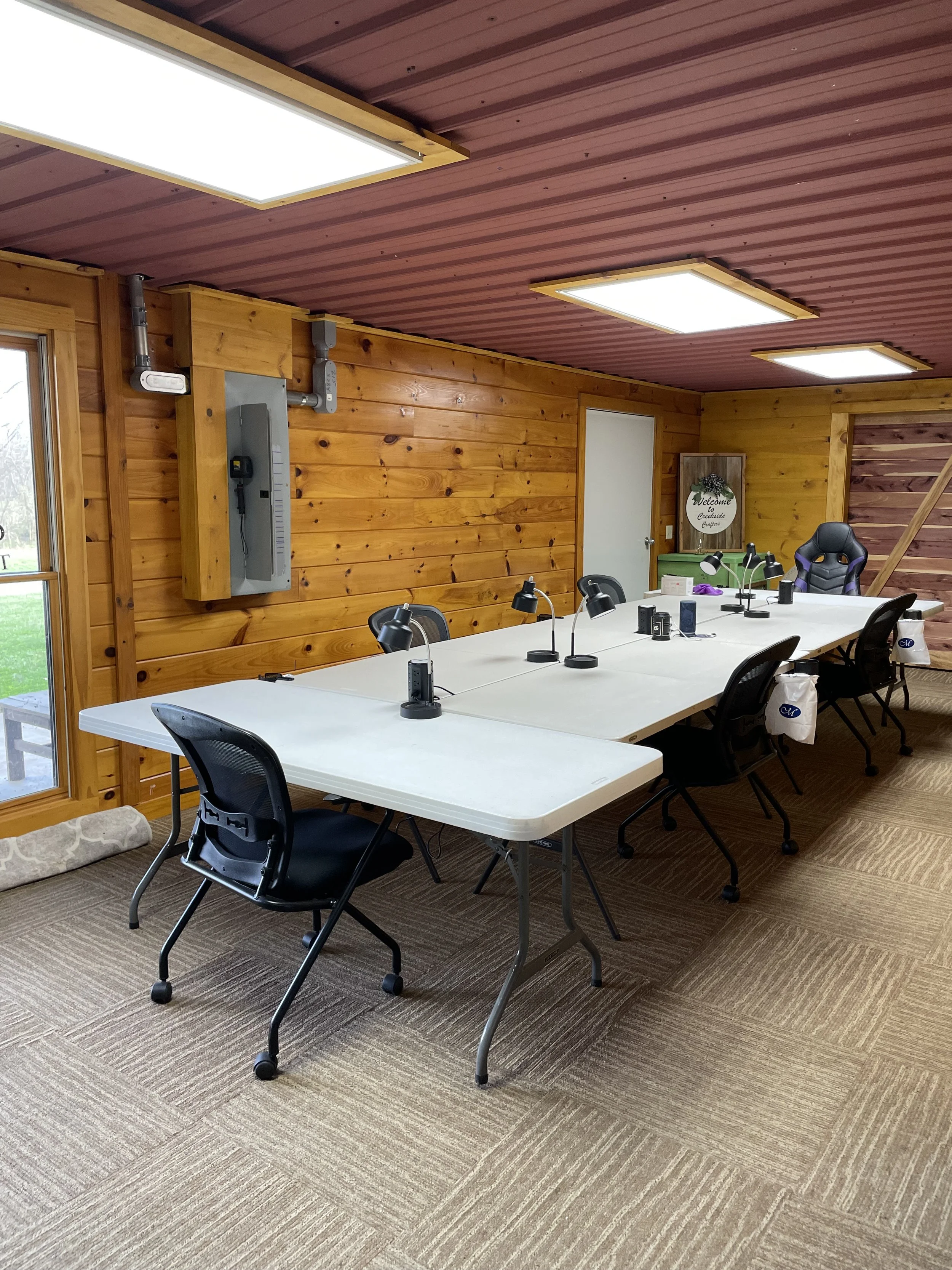 Spacious crafting room with 6 foot tables and individual lighting stations at Creekside Crafters women's retreat in Watertown Tennessee