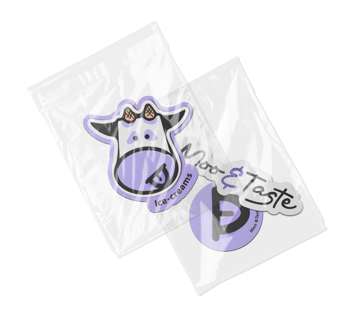 Two clear plastic bags with cow-themed stickers, one reading "Ice-creams" and the other "Moo & Tasty."