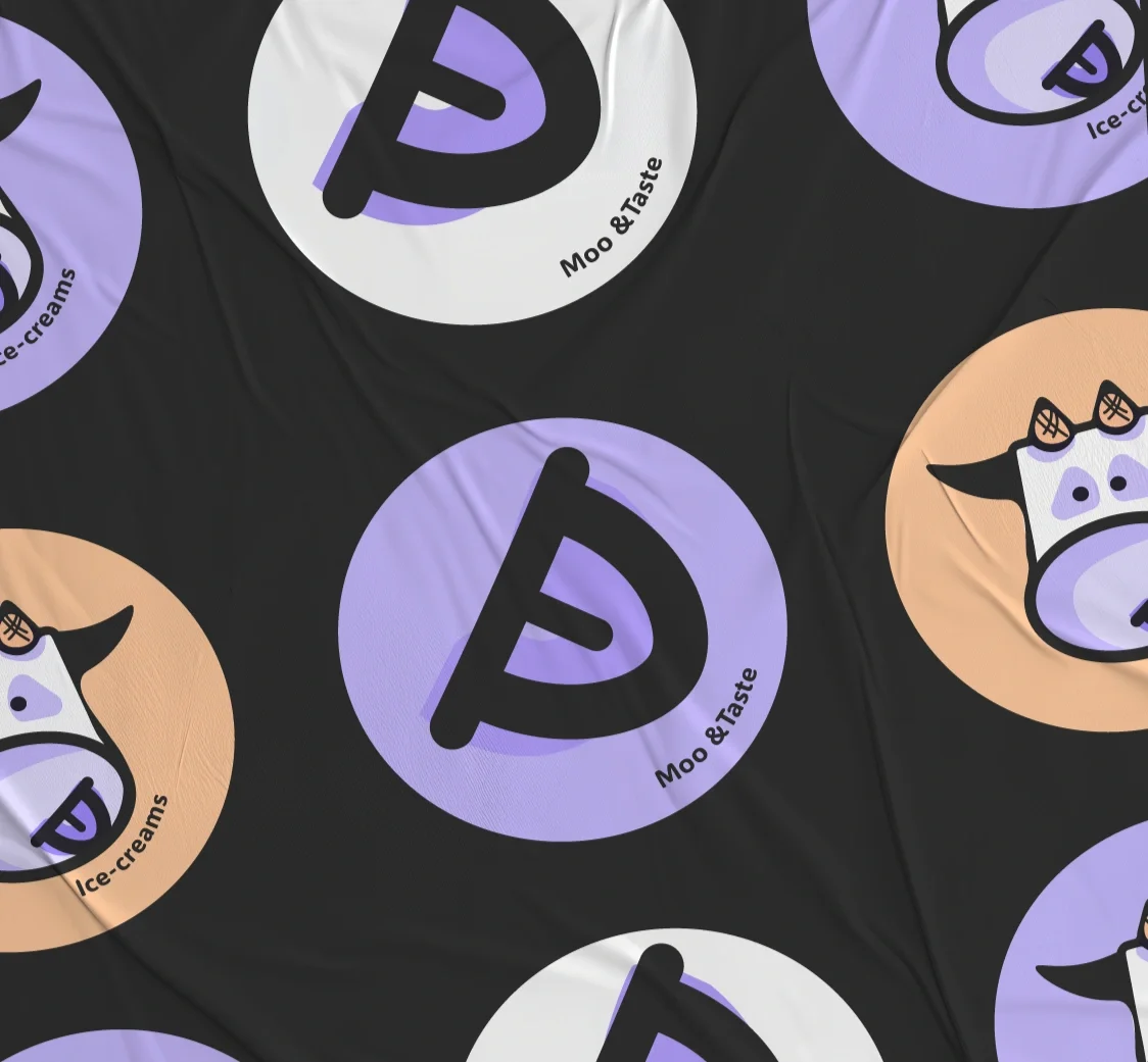 Patterned fabric featuring circular logos with a stylized 'D' and the words 'Moo & Taste' in purple, white, and beige colors.