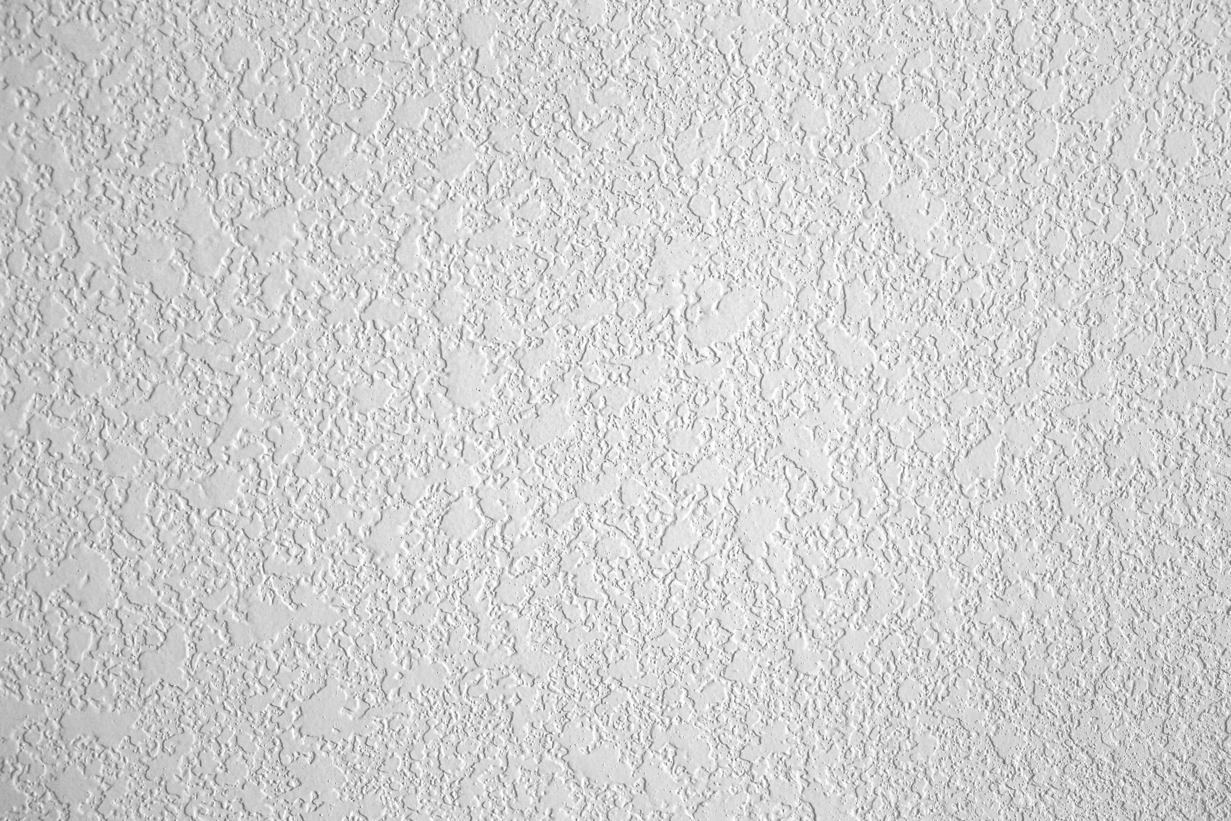 Textured white ceiling with a stucco pattern.