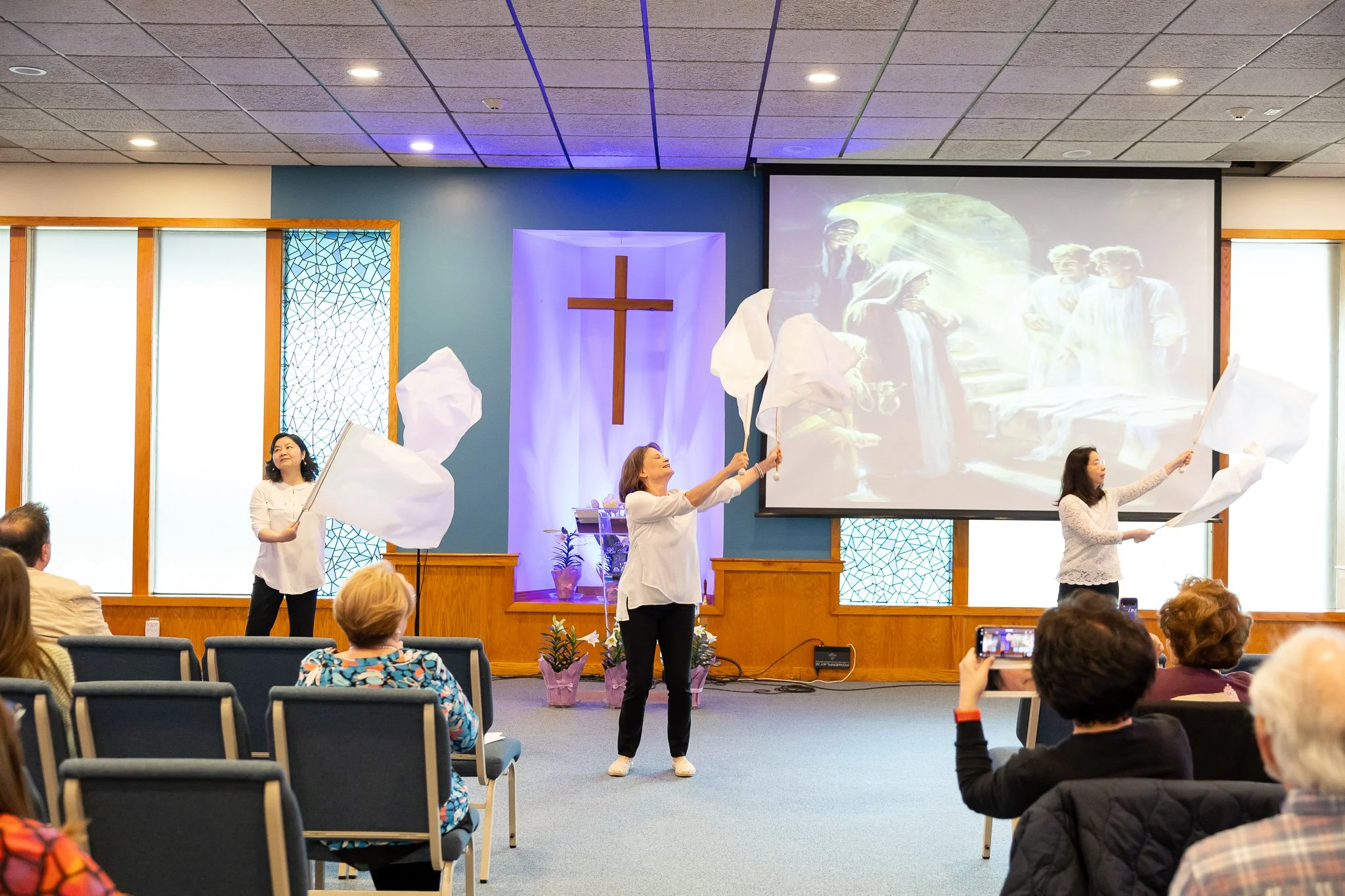 People Waving Flags at Church