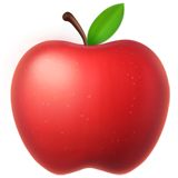 A close-up of a shiny red apple with a green leaf.