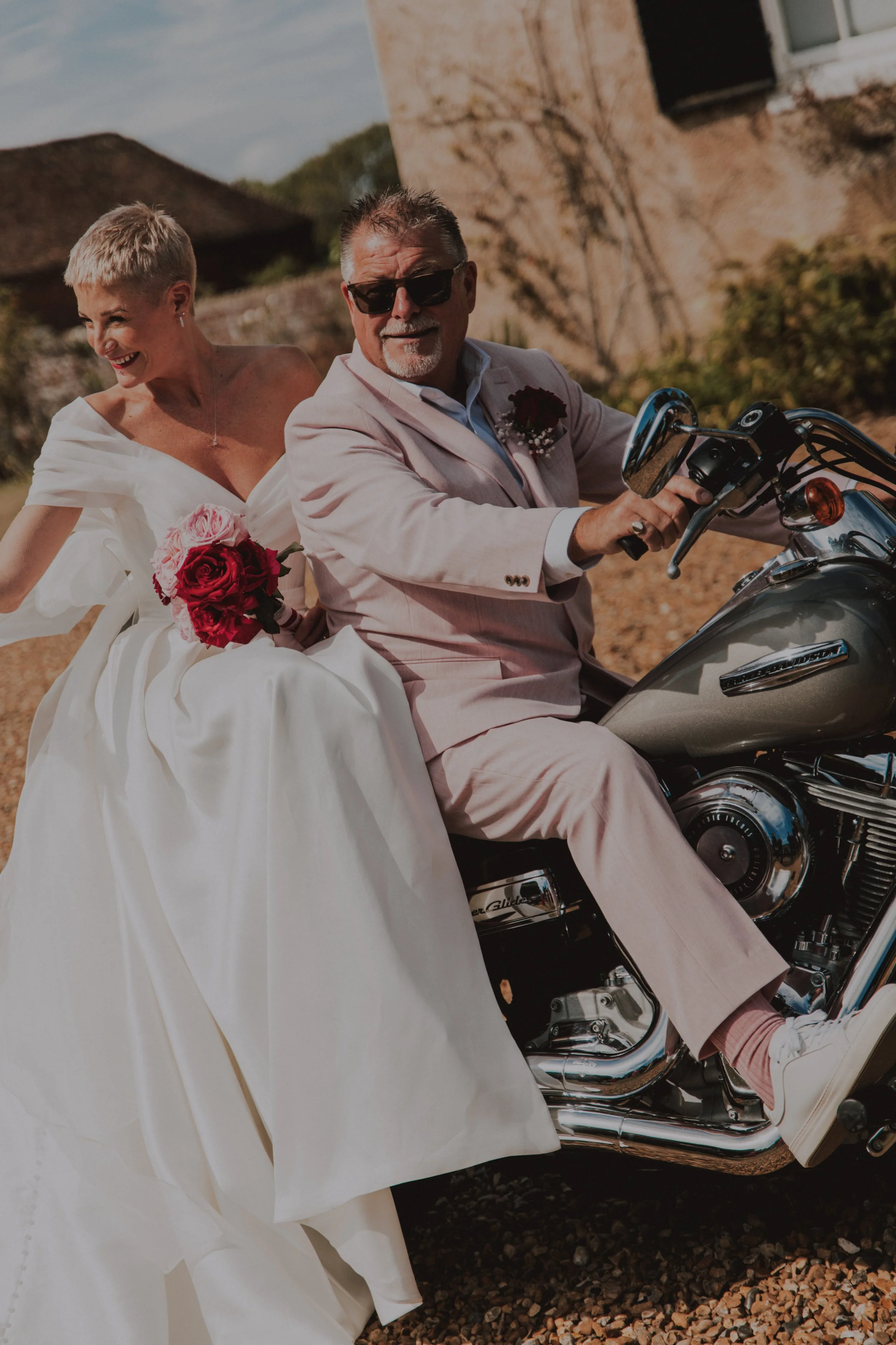 Bride on motorbike with her father