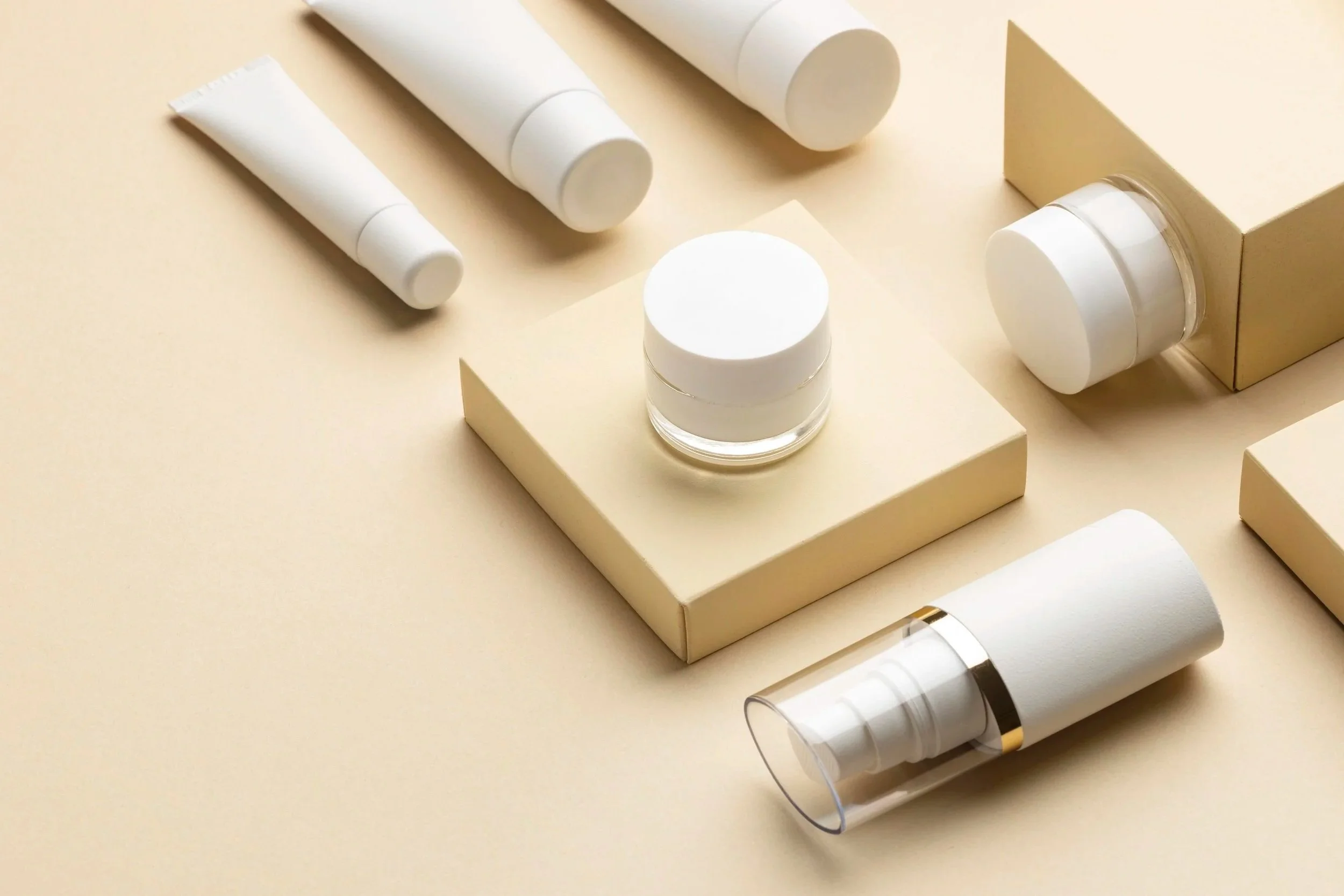 cosmetics container arrangement high-angle, without label, clean and neat background