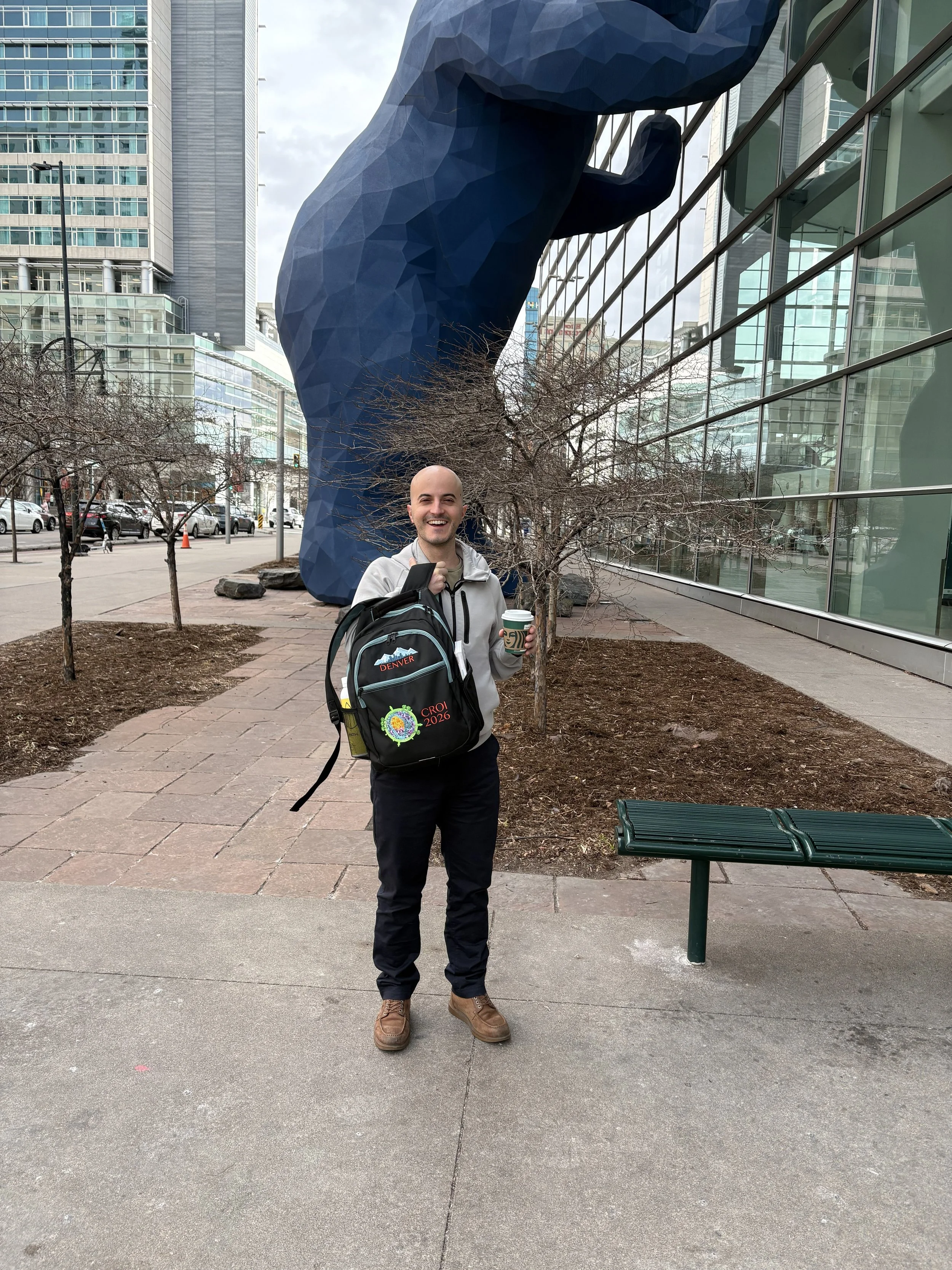 Giacomo and Statue CROI 2026.jpeg