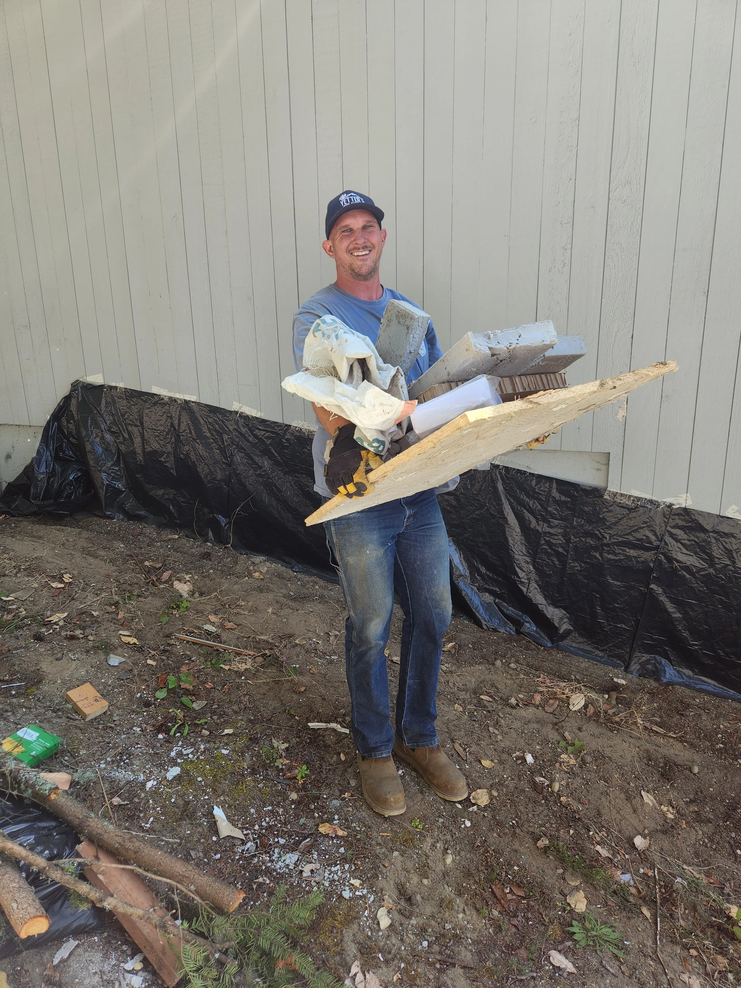 Mat removing yard debris from estate cleanout in kitsap county