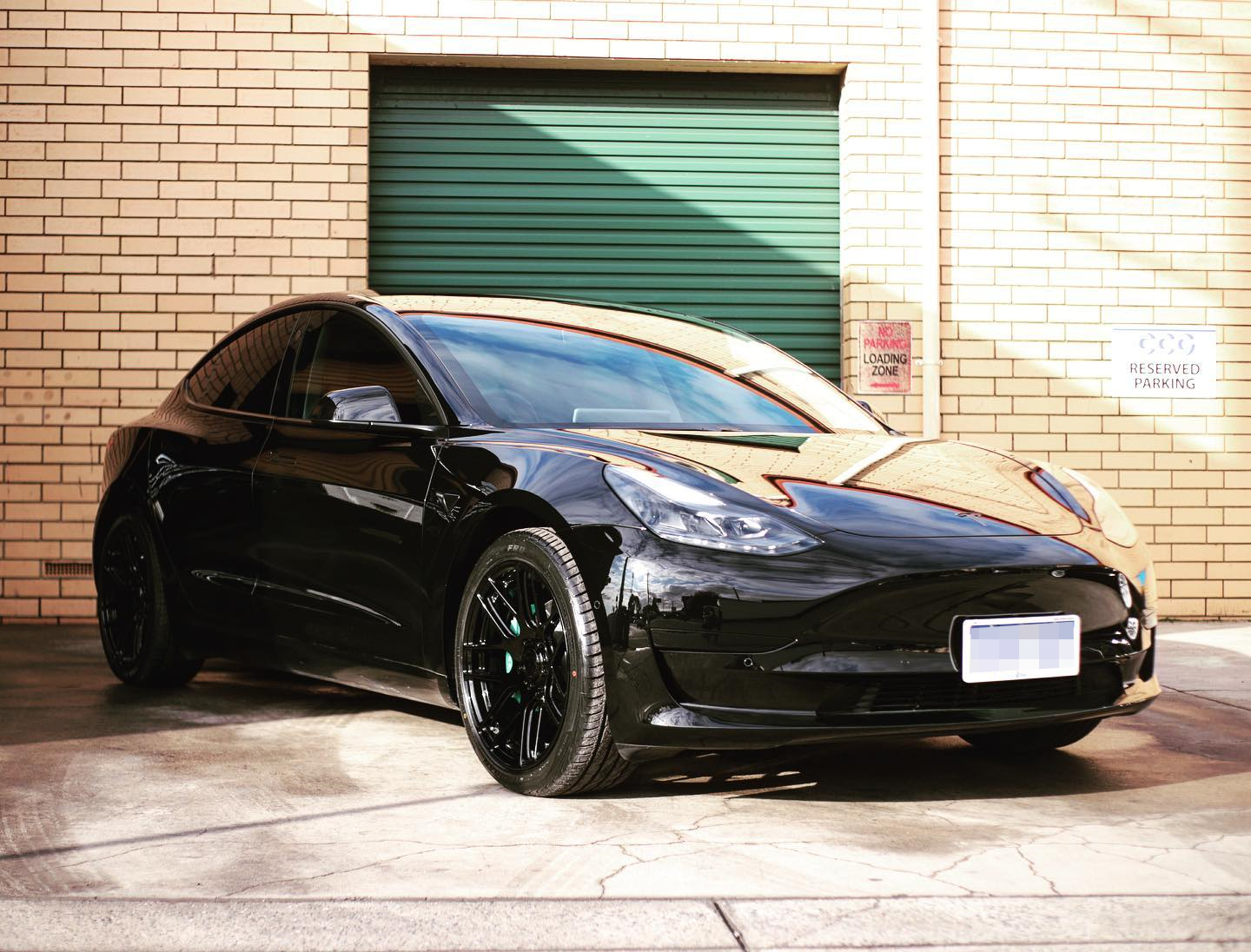 Tesla Model 3 Blackout Package with Gloss Black Rims and Custom Tiffany Blue Brake Calipers