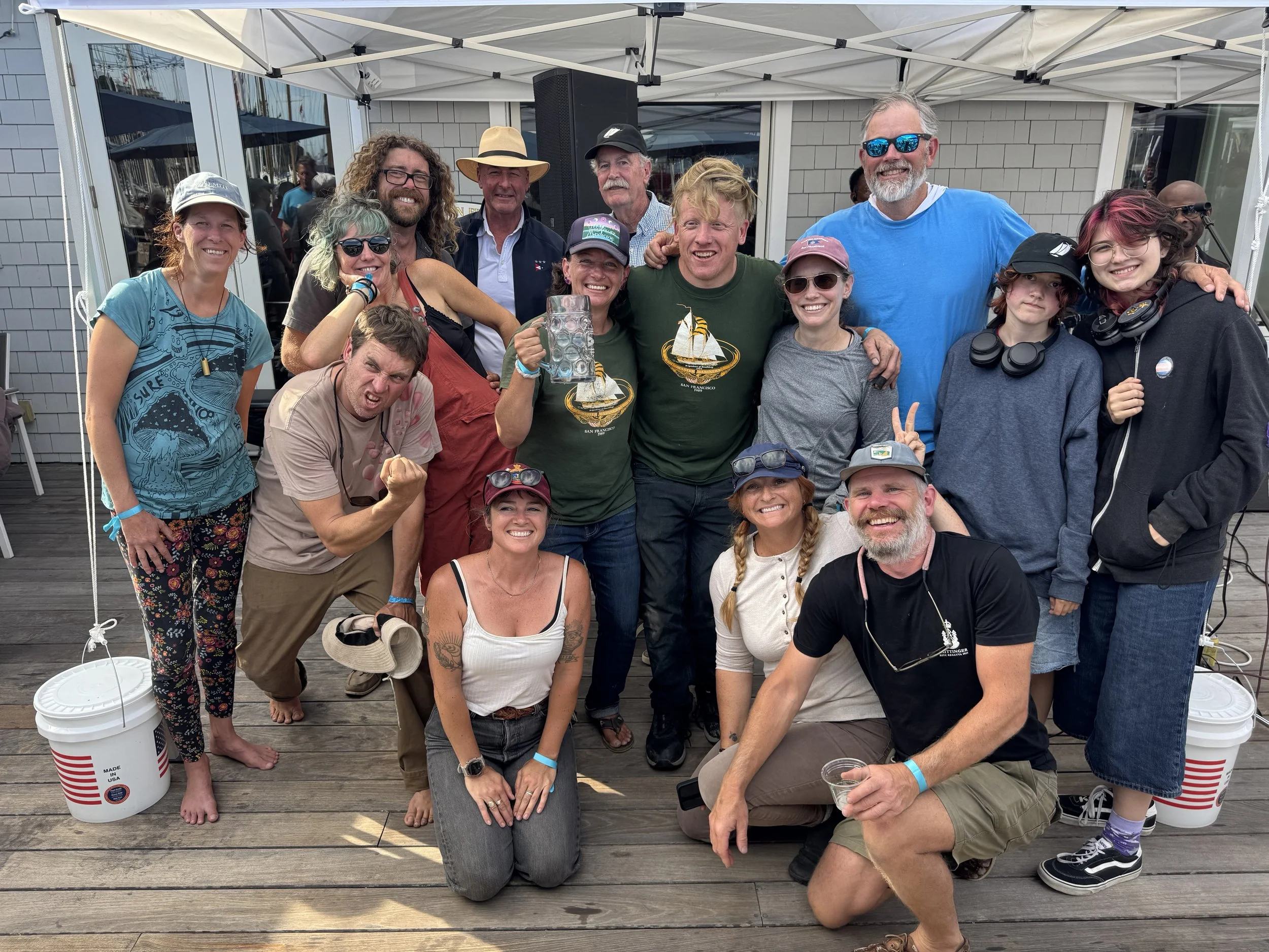 Lindsey and Terry Klaus, owners of Brigadoon, and crew receiving their 2nd place trophy for the Schooner fleet from Jr. S/C Quentin Hill, S/C John Swain.