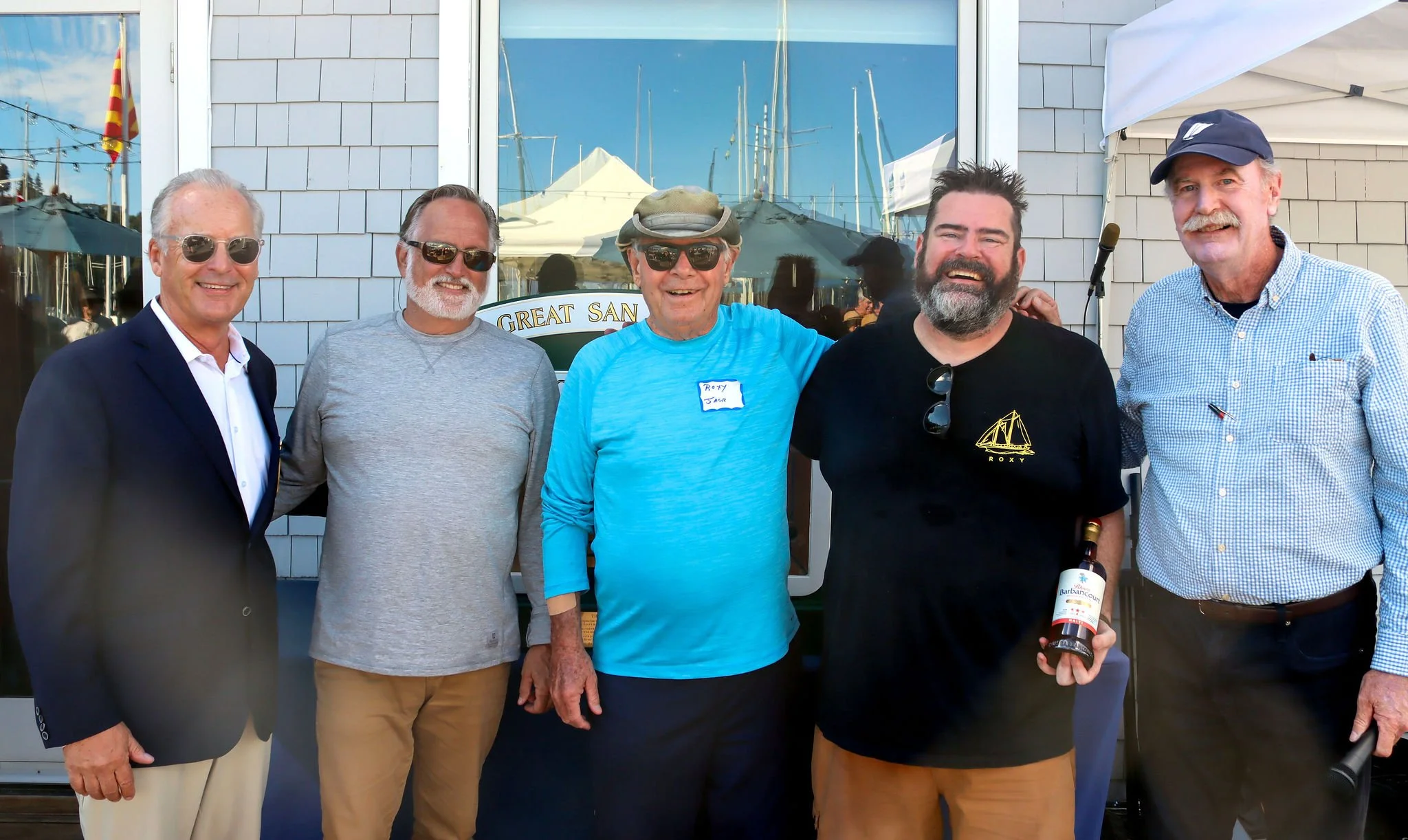 Sean and Jack Reynolds and crew of ROXY, accepting honors as the newest participating schooner, with SFYC Vice Commodore Jeff Cusack and Staff Commodore John Swain.