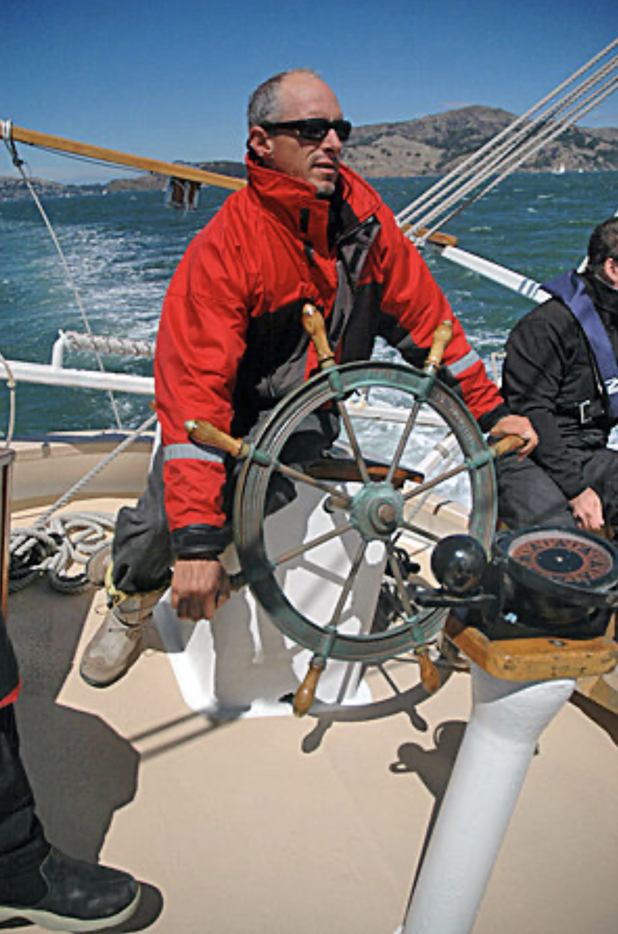Paul Dines at the helm of his gaff division runner-up Freda B, the most recent arrival to the Bay’s schooner scene.
© John Skoriak