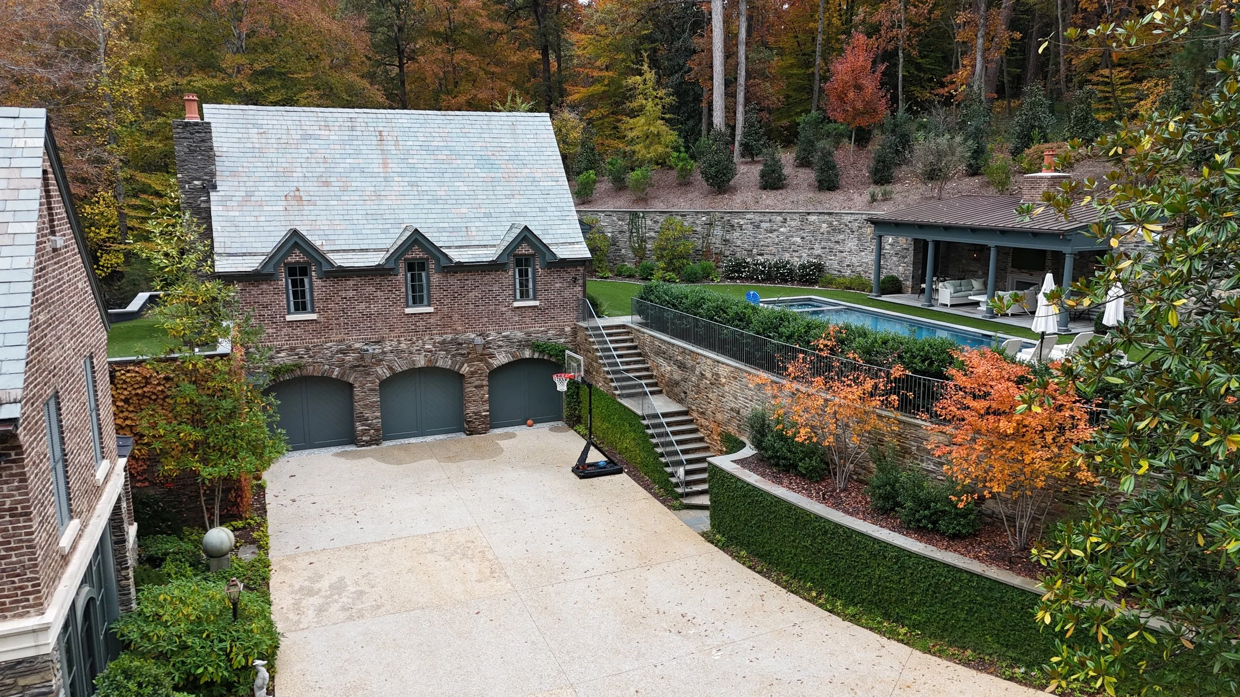 3 car garage, landscaping, brick exterior whole house renovation Whole house renovation and addition pool, pool house, outdoor living Built or renovated by Macallan Custom Homes in Atlanta, GA. Custom Home and Renovations Builder